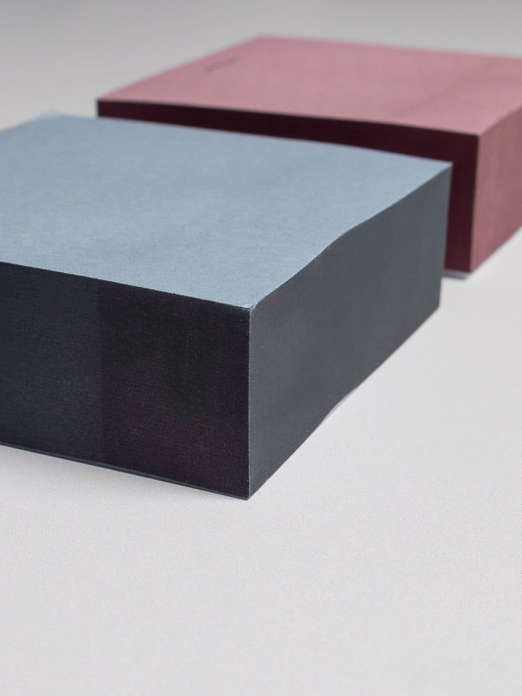 Close up view at an angle of Colorblock Sticky Note Set displaying the darker toned edge paint on each set.