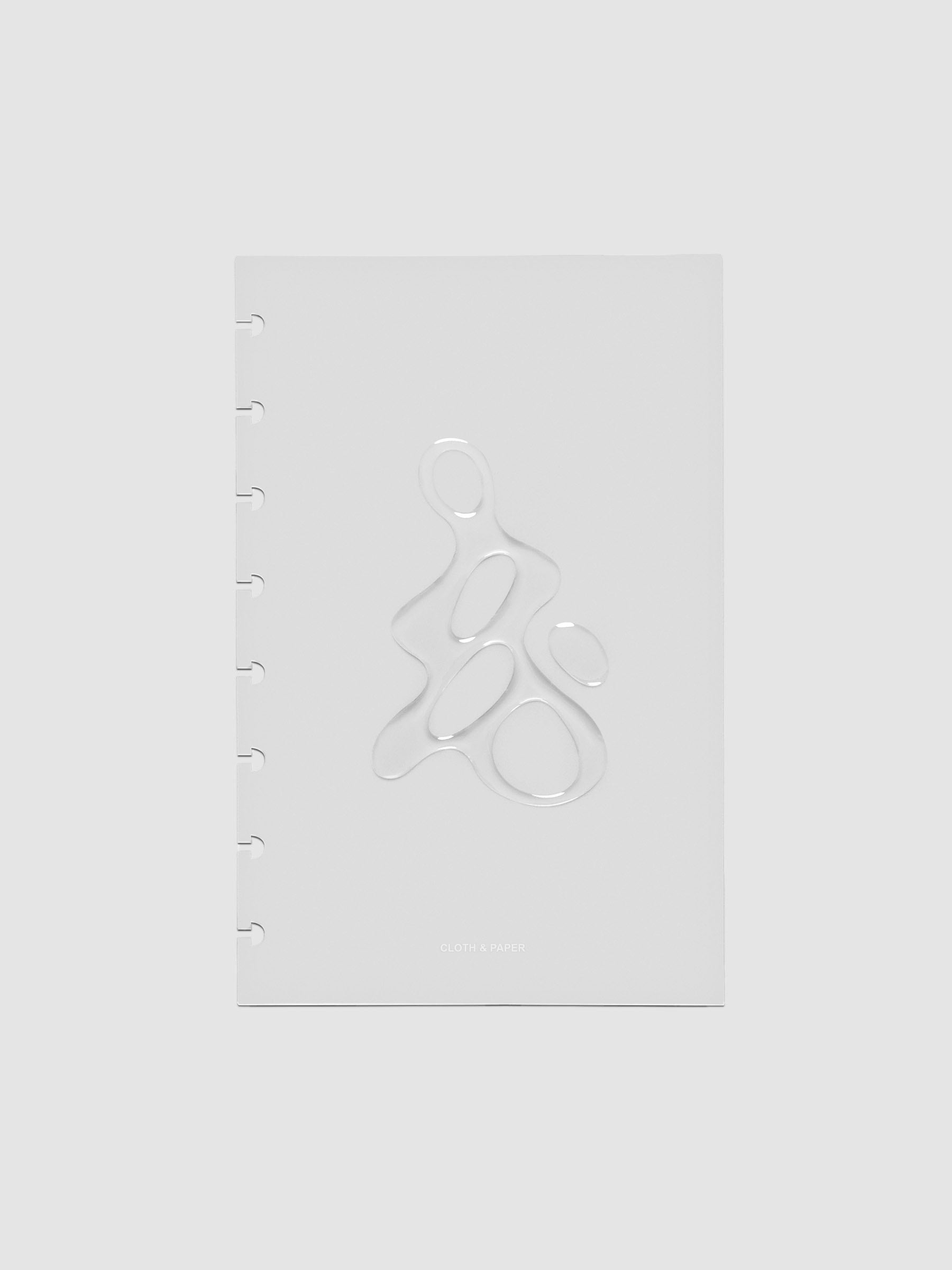 Light grey, semi-transparent, and glossy plastic planner dashboard with organic raised shape design in size Half Letter on a neutral background.