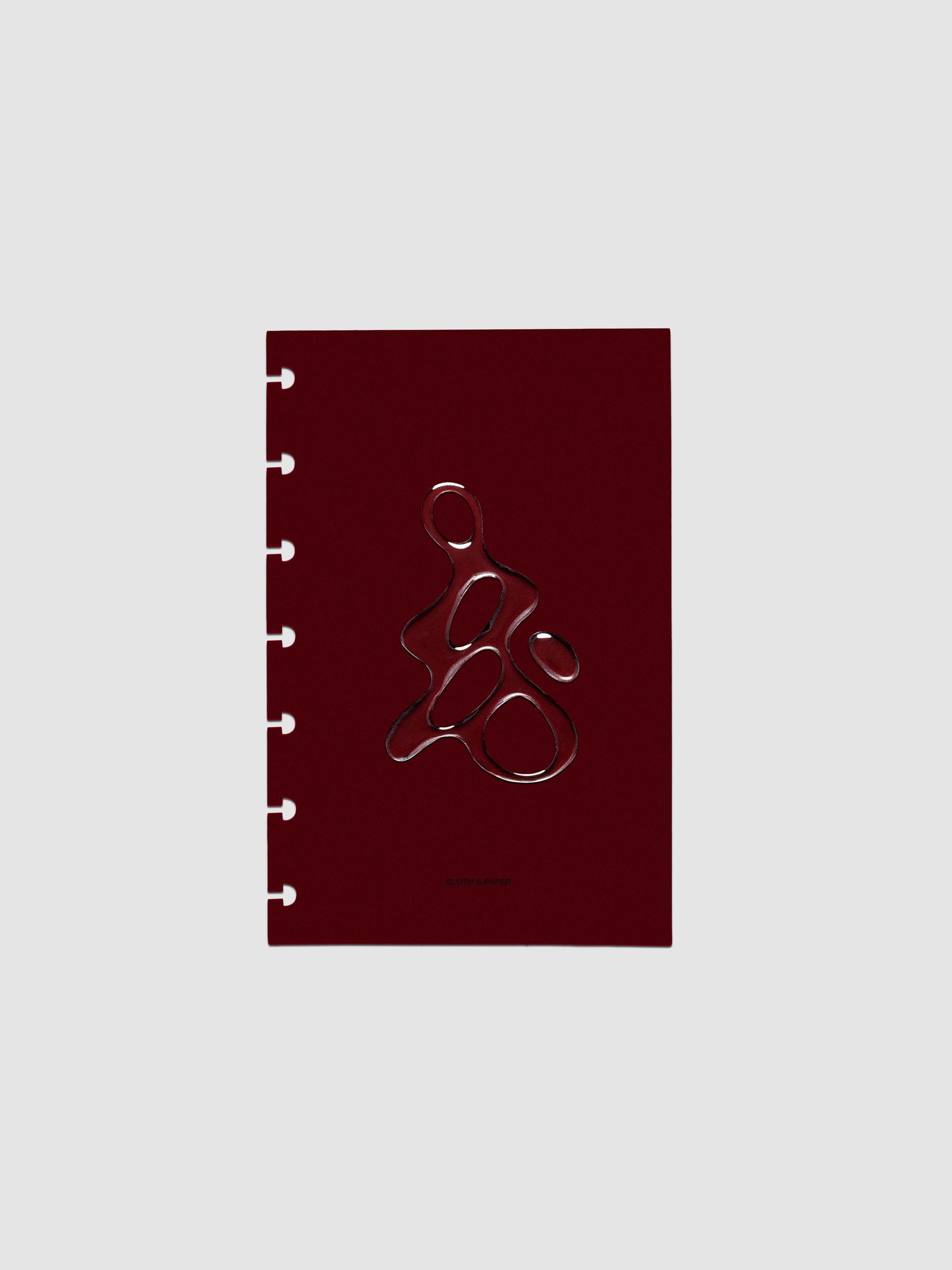 Dark red, semi-transparent, and glossy plastic planner dashboard with organic raised shape design in size HP Mini on a neutral background.