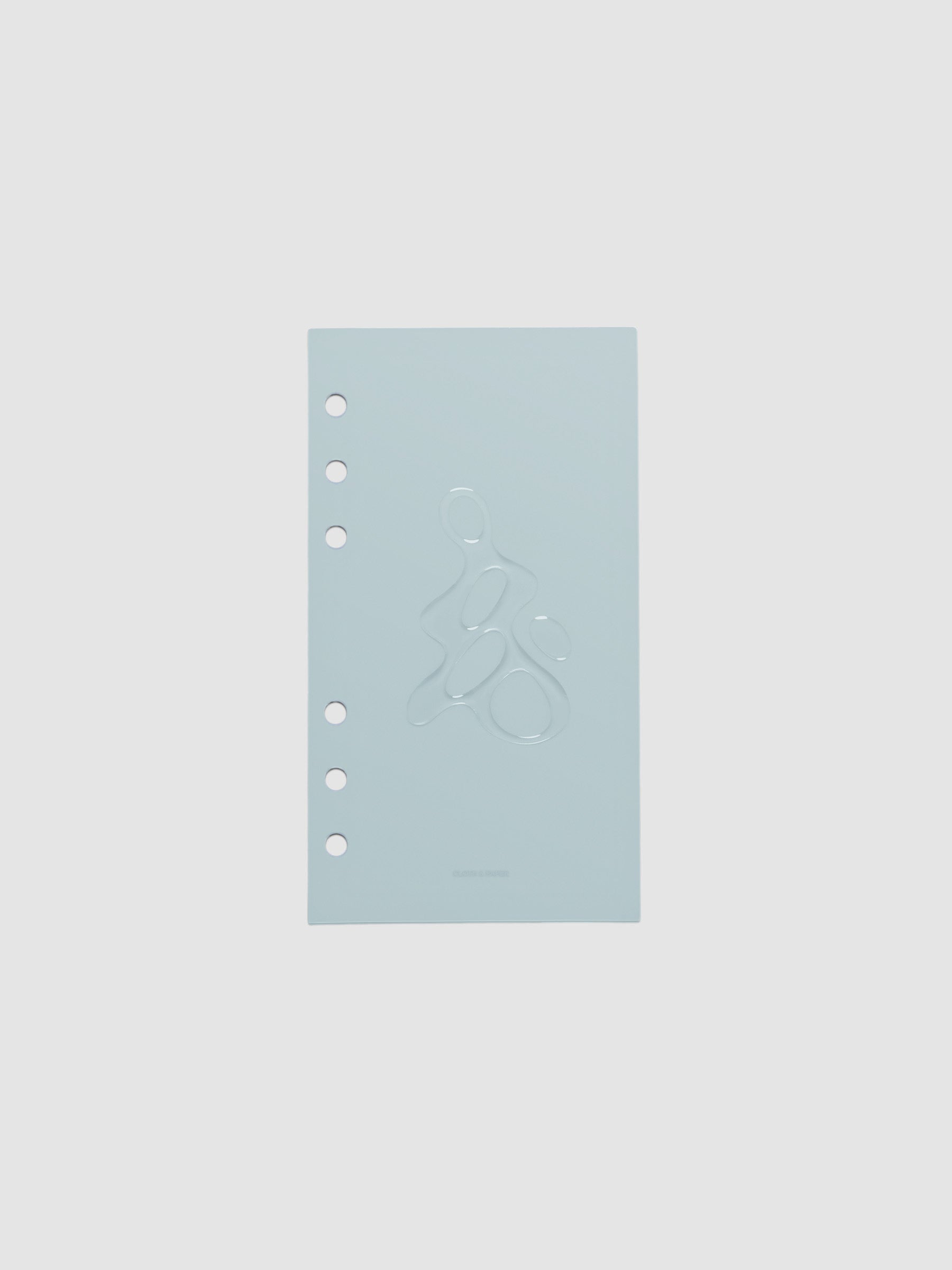 Light blue, semi-transparent, and glossy plastic planner dashboard with organic raised shape design in size Personal on a neutral background.