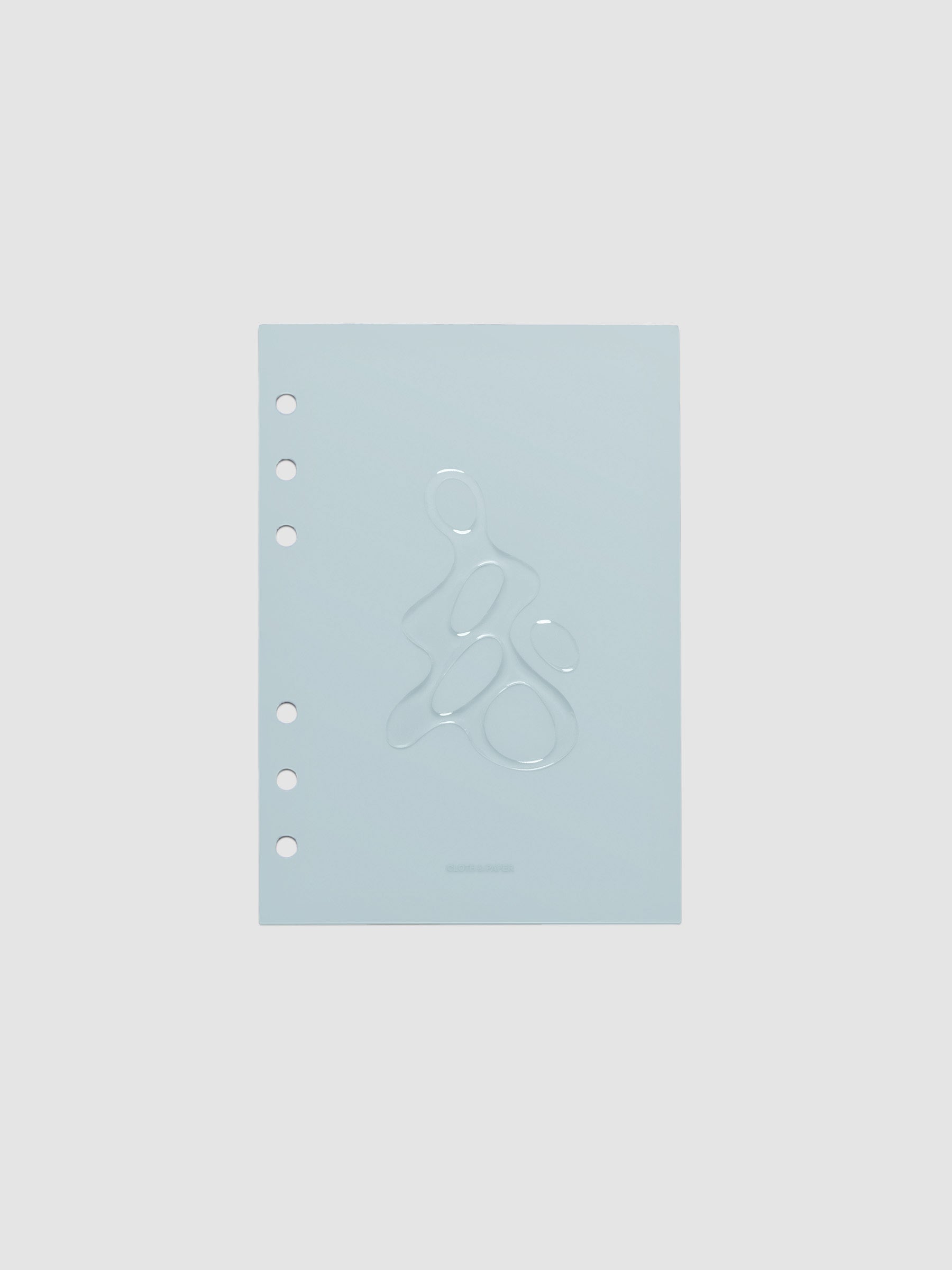 Light blue, semi-transparent, and glossy plastic planner dashboard with organic raised shape design in size Personal Wide on a neutral background.
