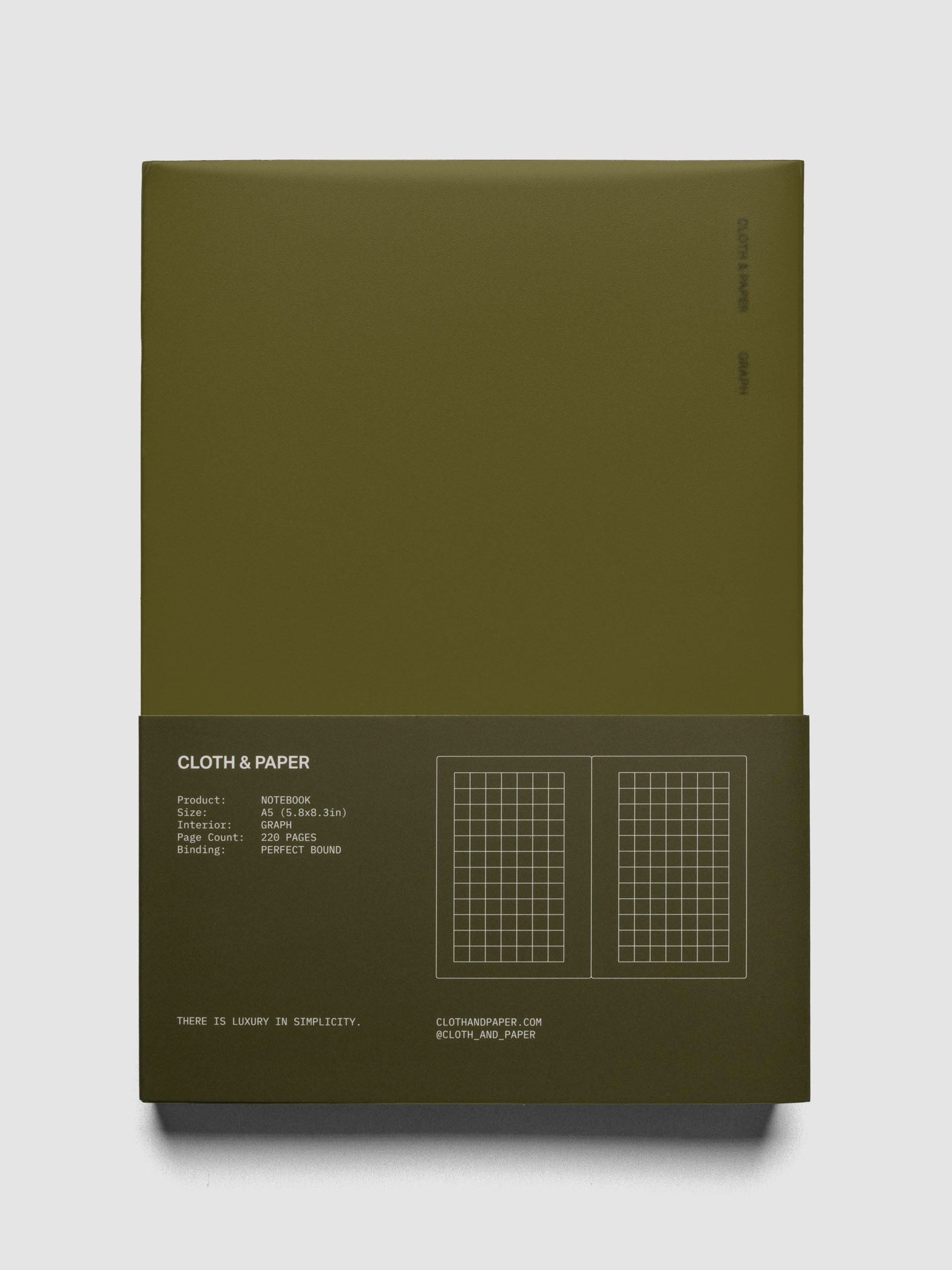 Perfect Bound Notebook | A5 | Graph | Olive shown laid flat, closed, in packaging on a neutral background.