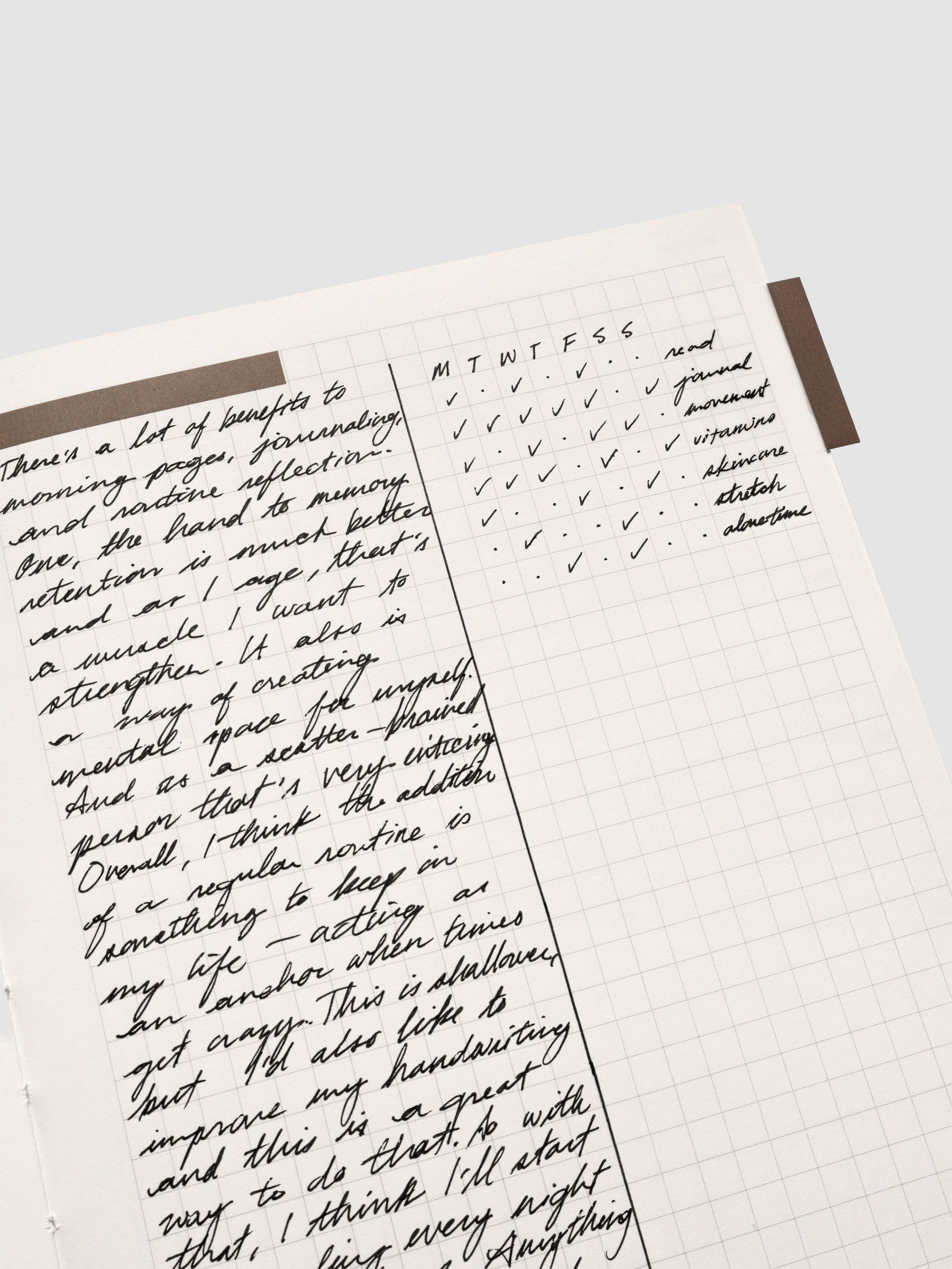 Close up of the Perfect Bound Notebook | A5 | Weekly Agenda | Matcha showing the graph notes layout with handwritten notes as an example for use.