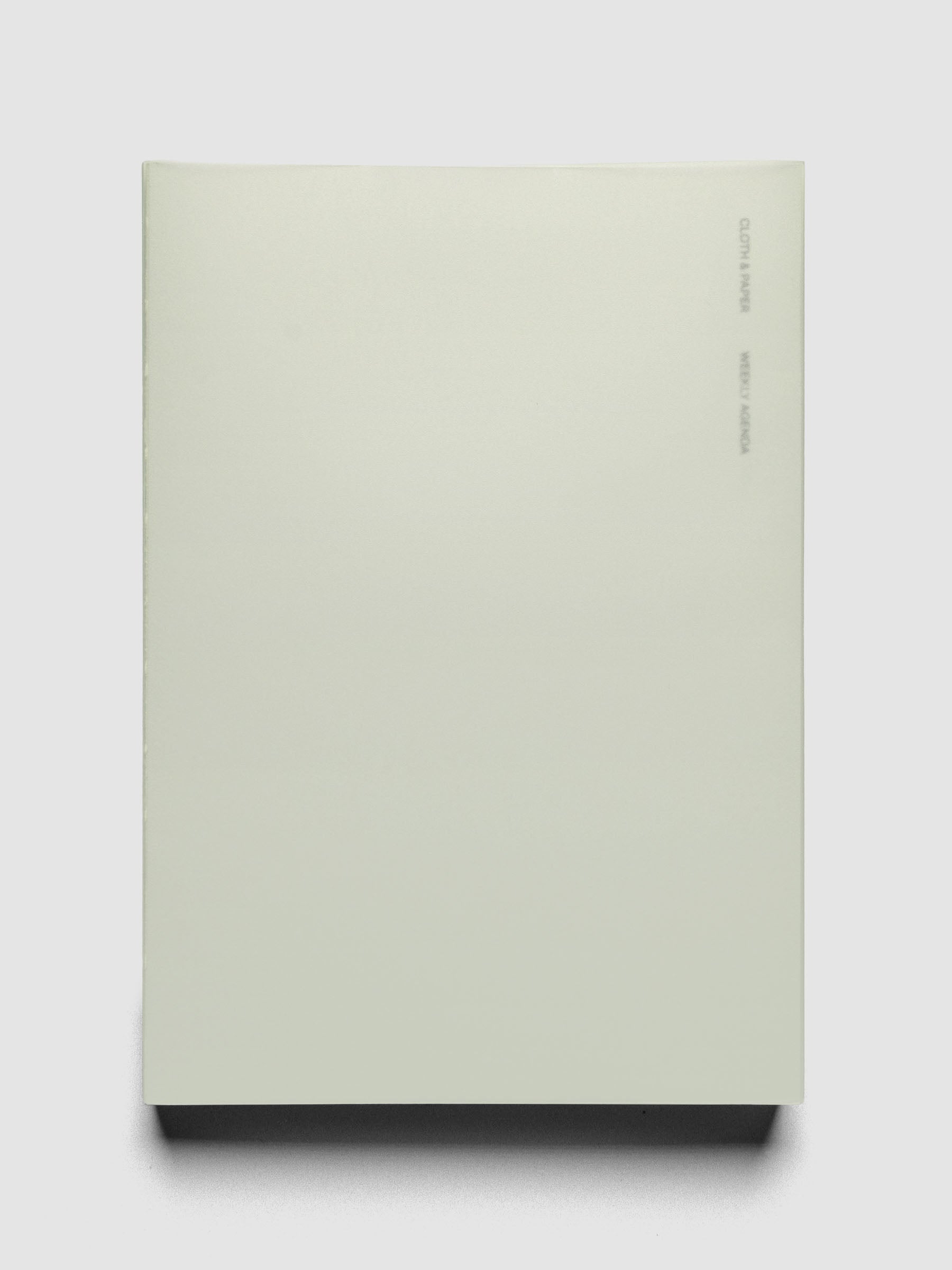 Perfect Bound Notebook | A5 | Weekly Agenda | Matcha shown closed, laid flat, on a neutral background.