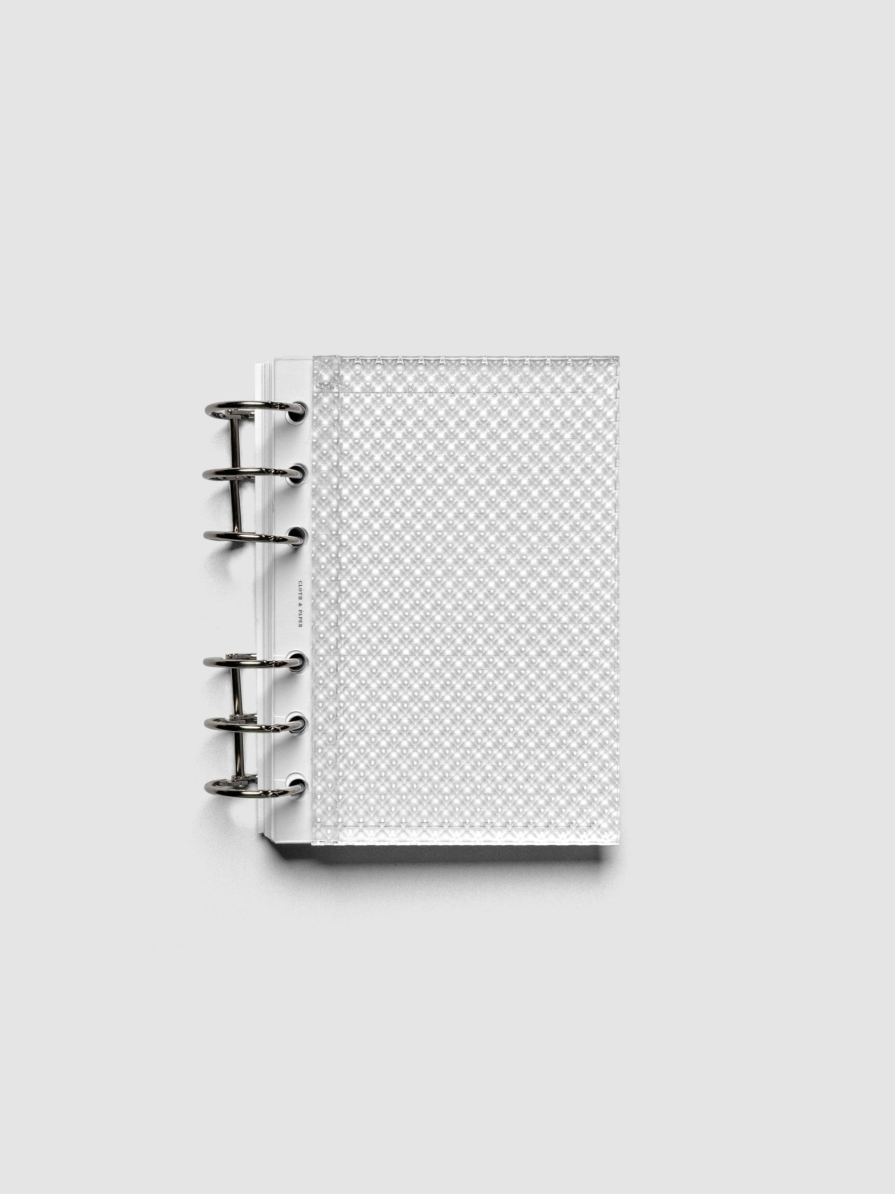 Clear, textured Studded Planner Dashboard in the size A6, shown ringbound.