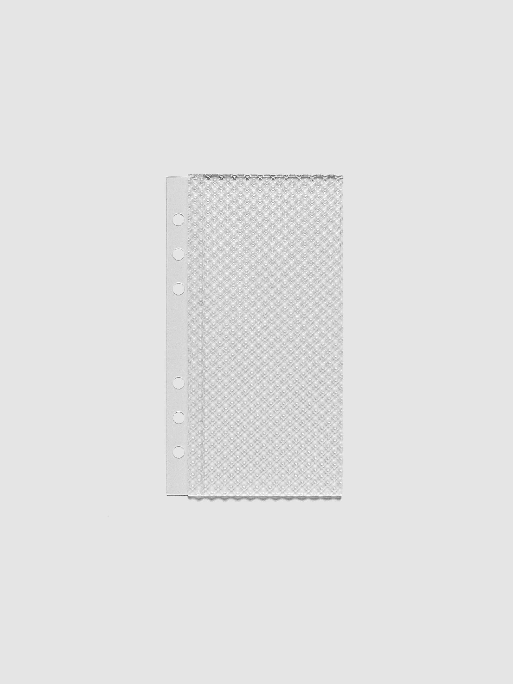 Clear, textured Studded Planner Dashboard in the size Personal, on a neutral background.