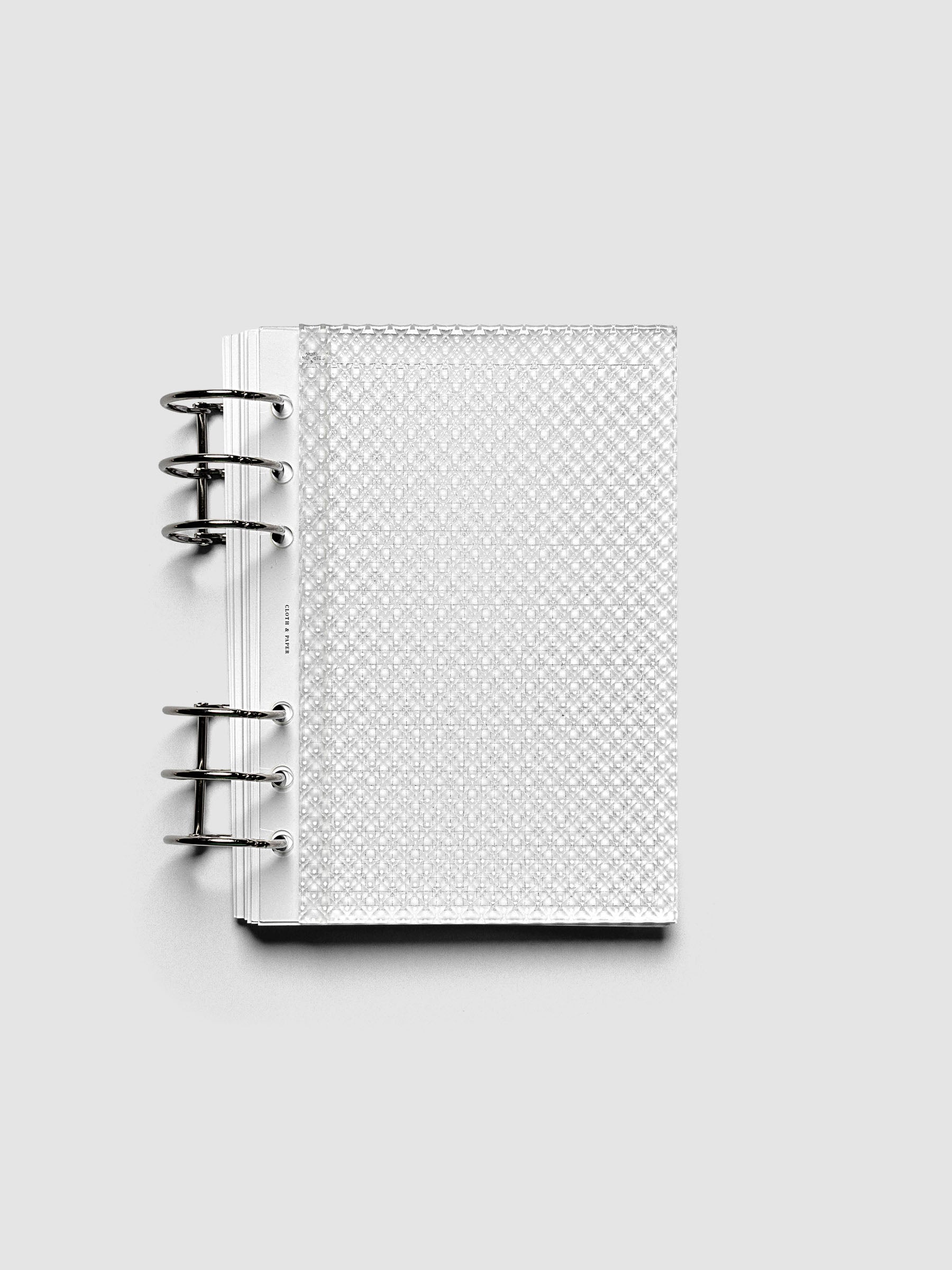 Clear, textured Studded Planner Dashboard in the size Personal Wide, shown ringbound on a neutral background.