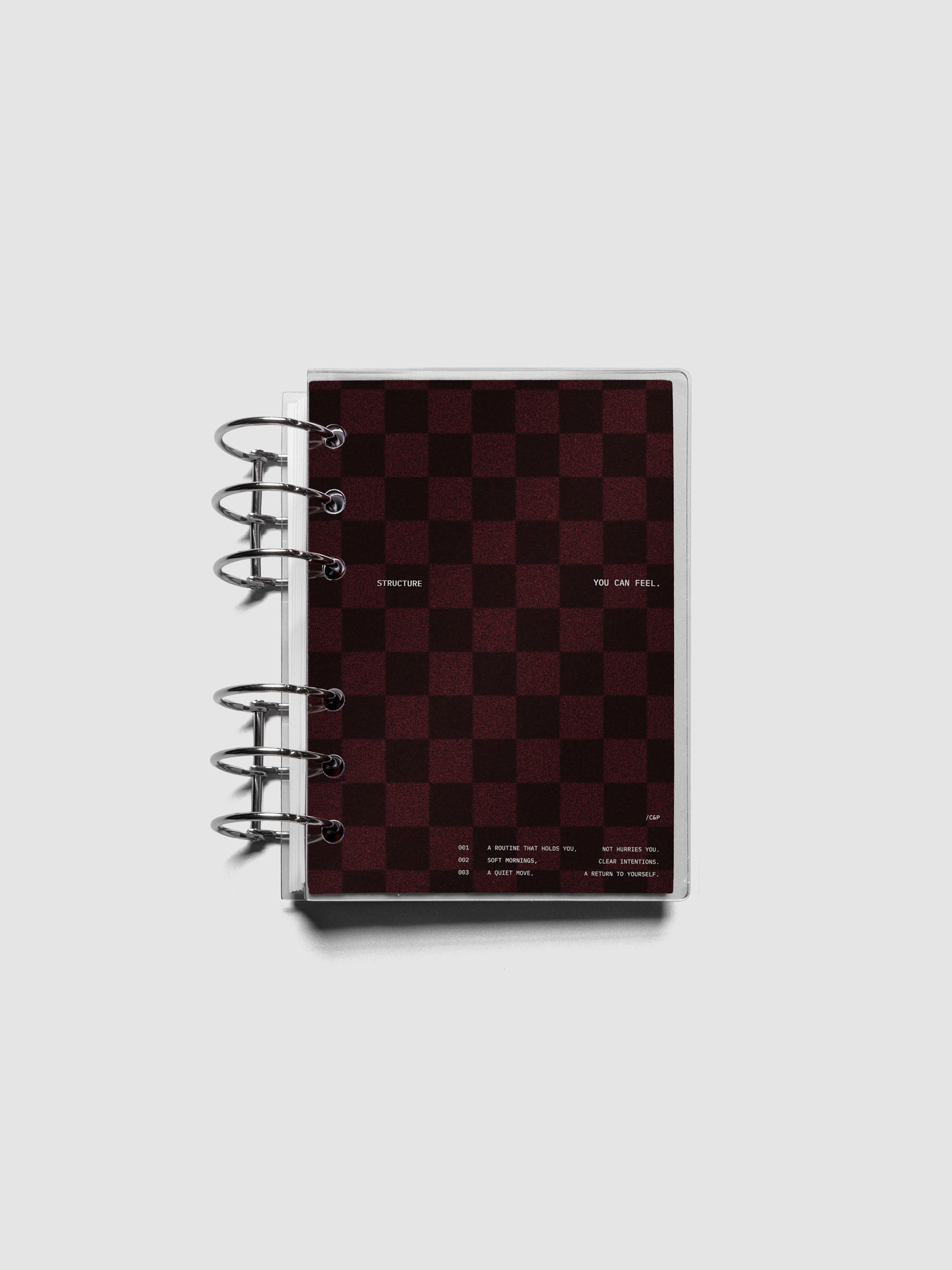 A6 sized velvet checkered dashboard in the color Bordeaux with crystal clear planner dashboard shown ringbound.