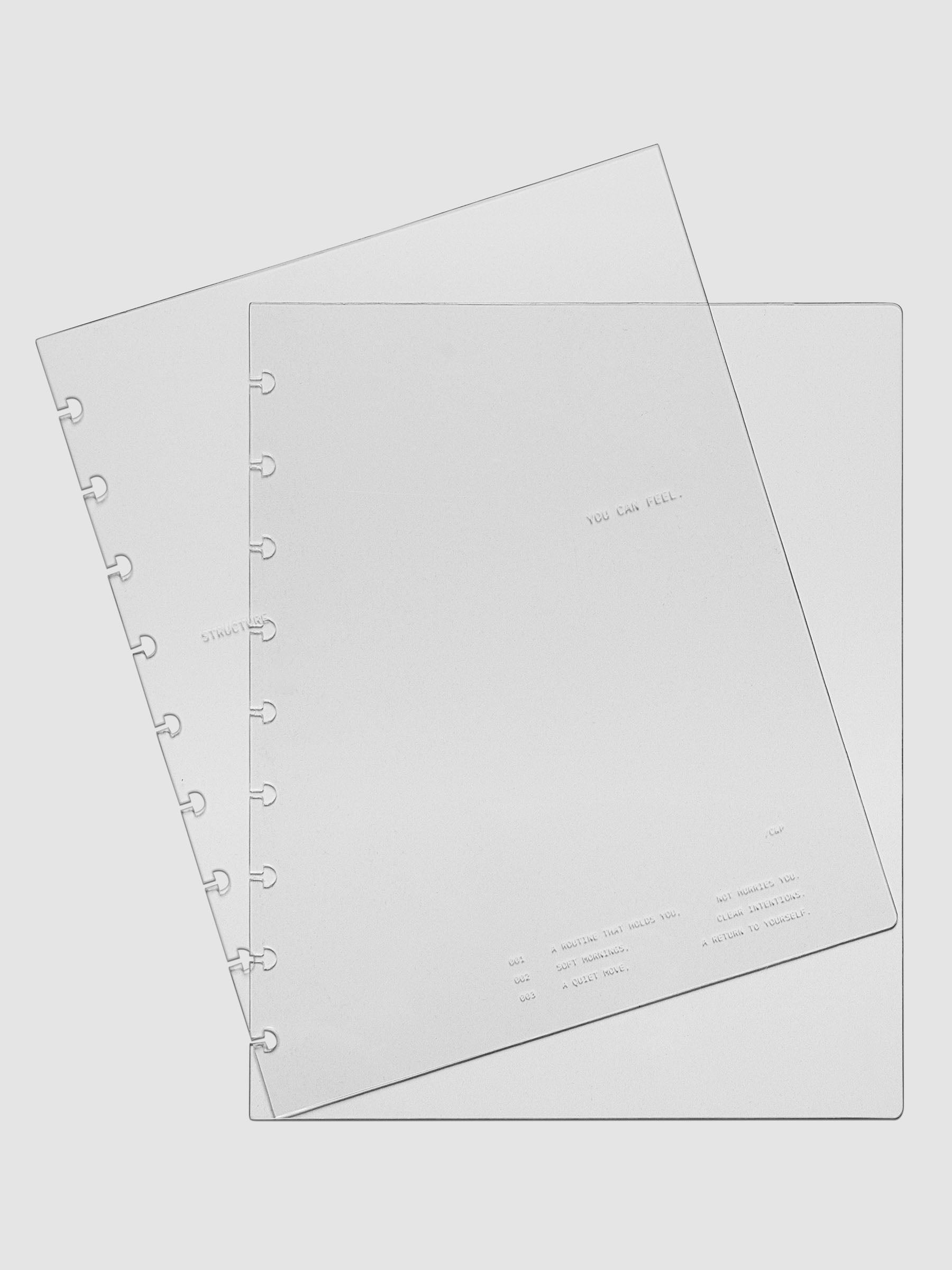 HP Classic sized crystal clear plastic planner cover set with text printed on the cover on the theme of structure and routines.