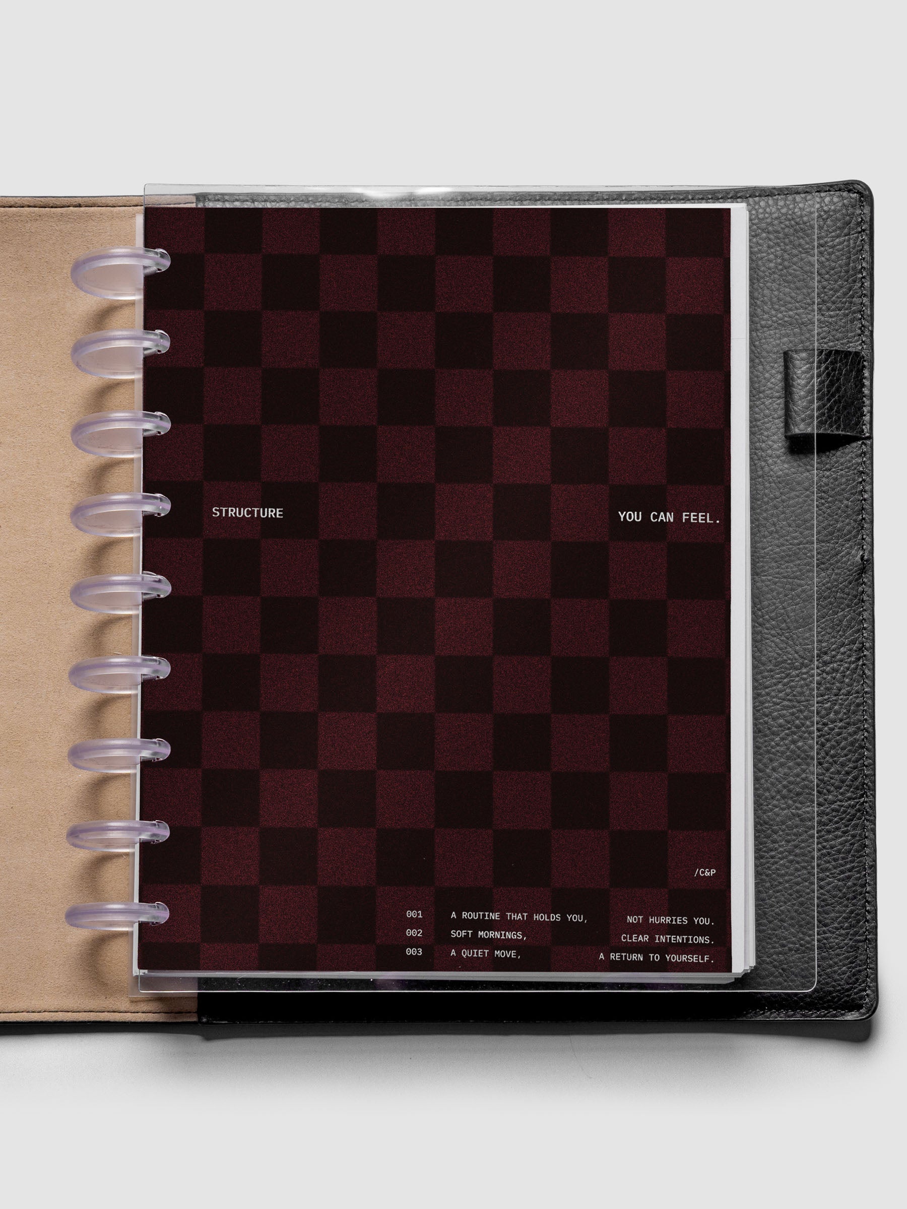 HP Classic sized velvet checkered dashboard in the color Bordeaux with crystal clear planner dashboard shown inside a black leather folio.