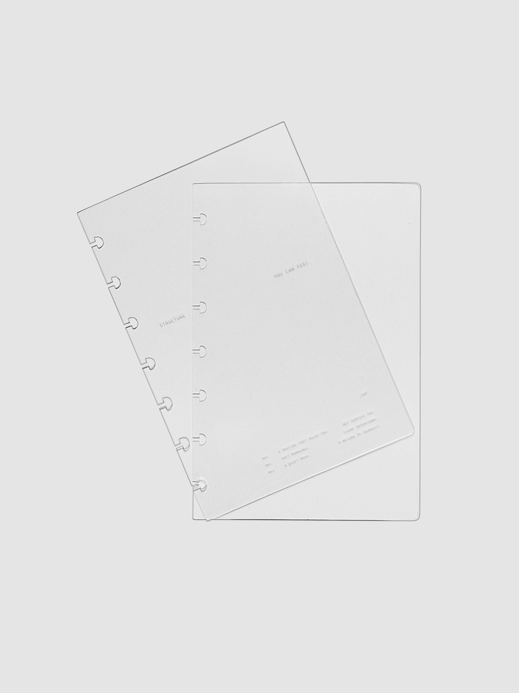 HP Mini sized crystal clear plastic planner cover set with text printed on the cover on the theme of structure and routines.