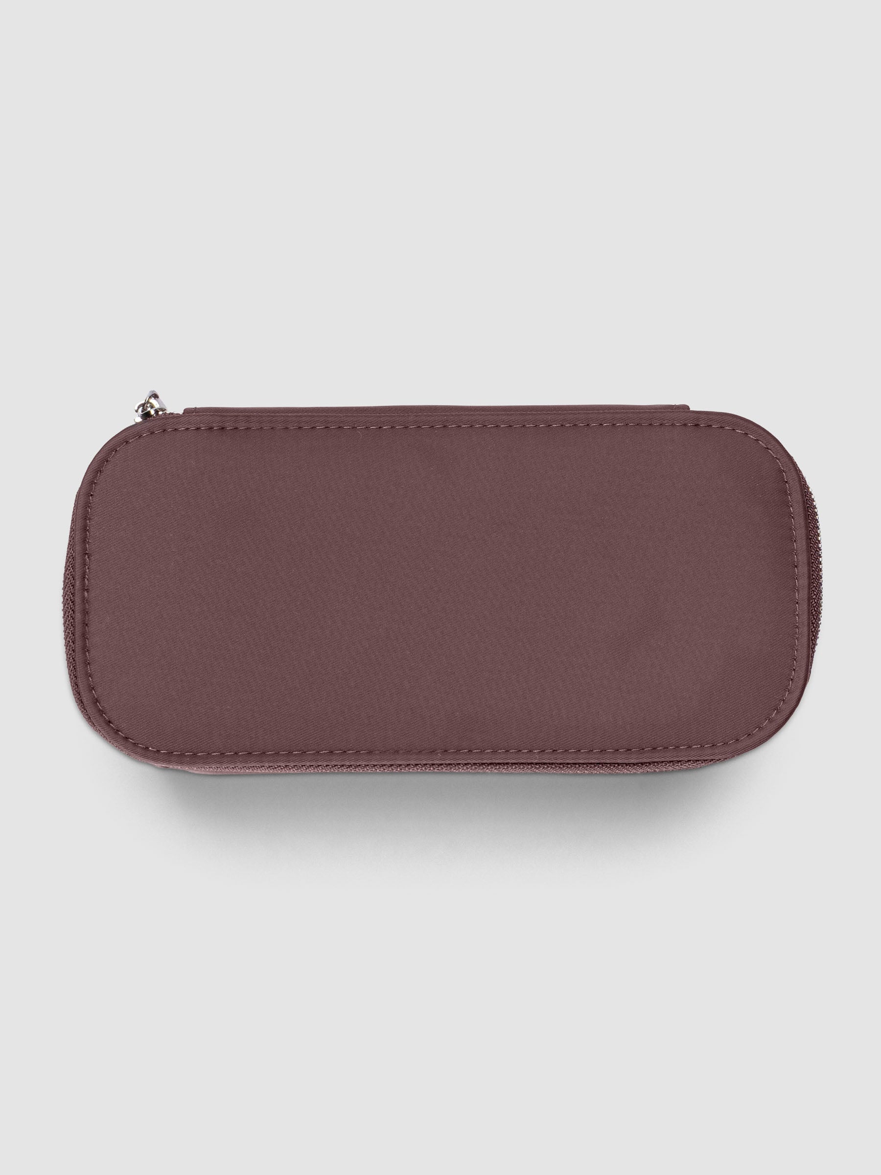 Small packing cube in the color walnut against a neutral background.