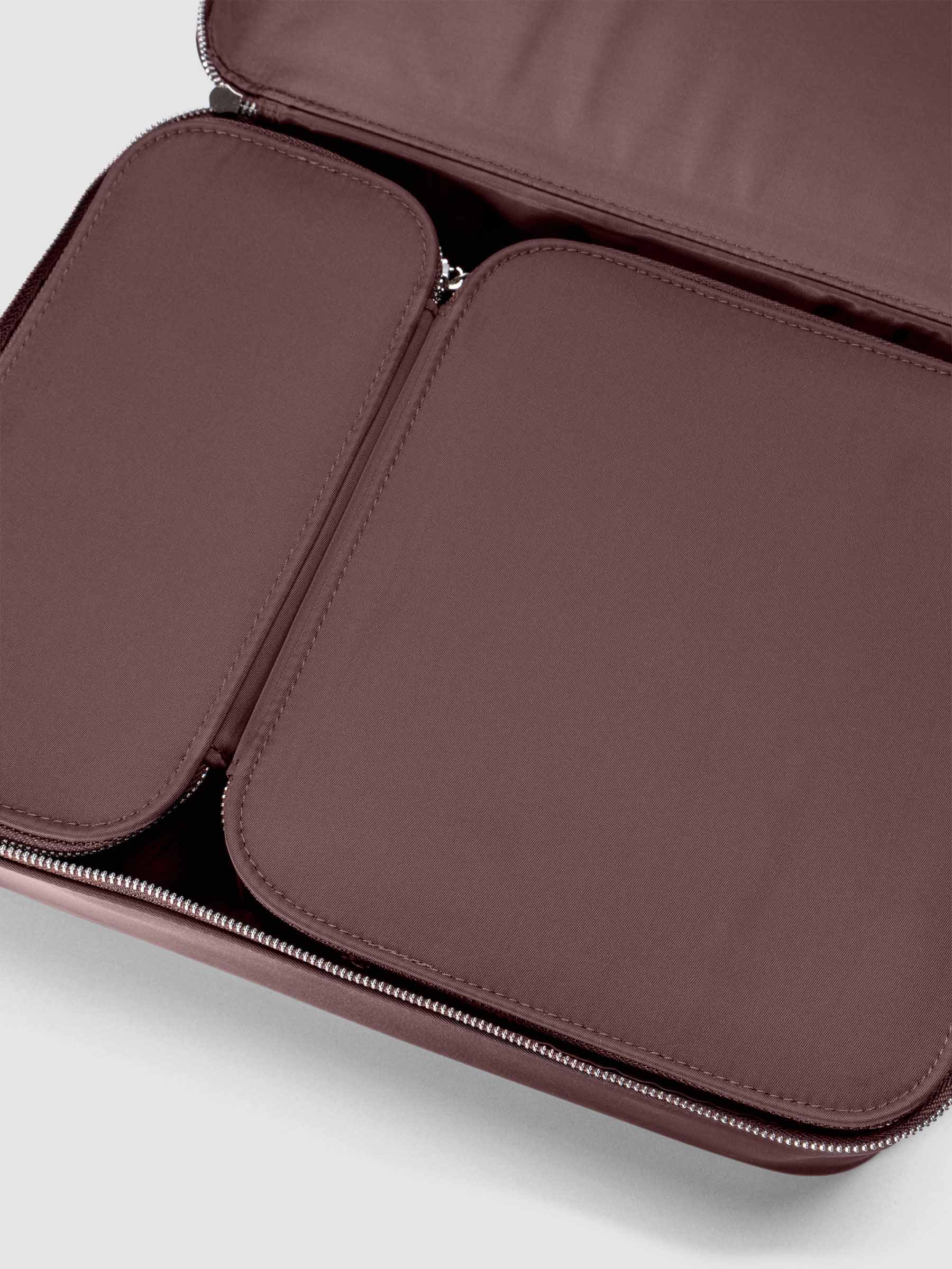 Close up view of small and medium packing cubes nested side-by-side in the large packing cube.