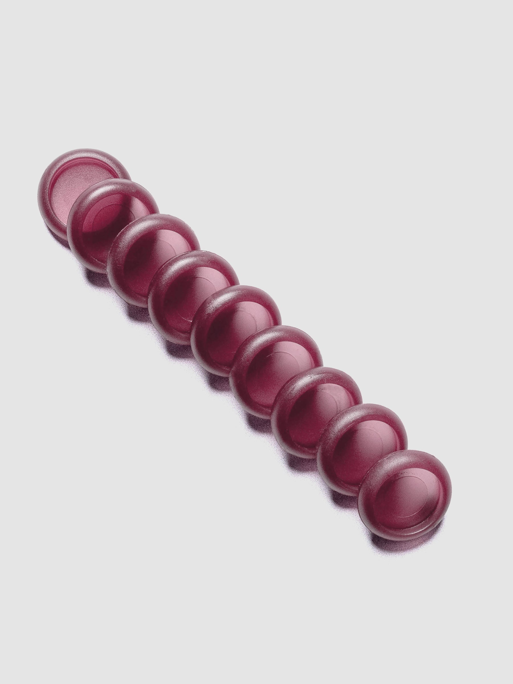 Set of nine transparent, red-hued, planner discs in size 0.75 in.