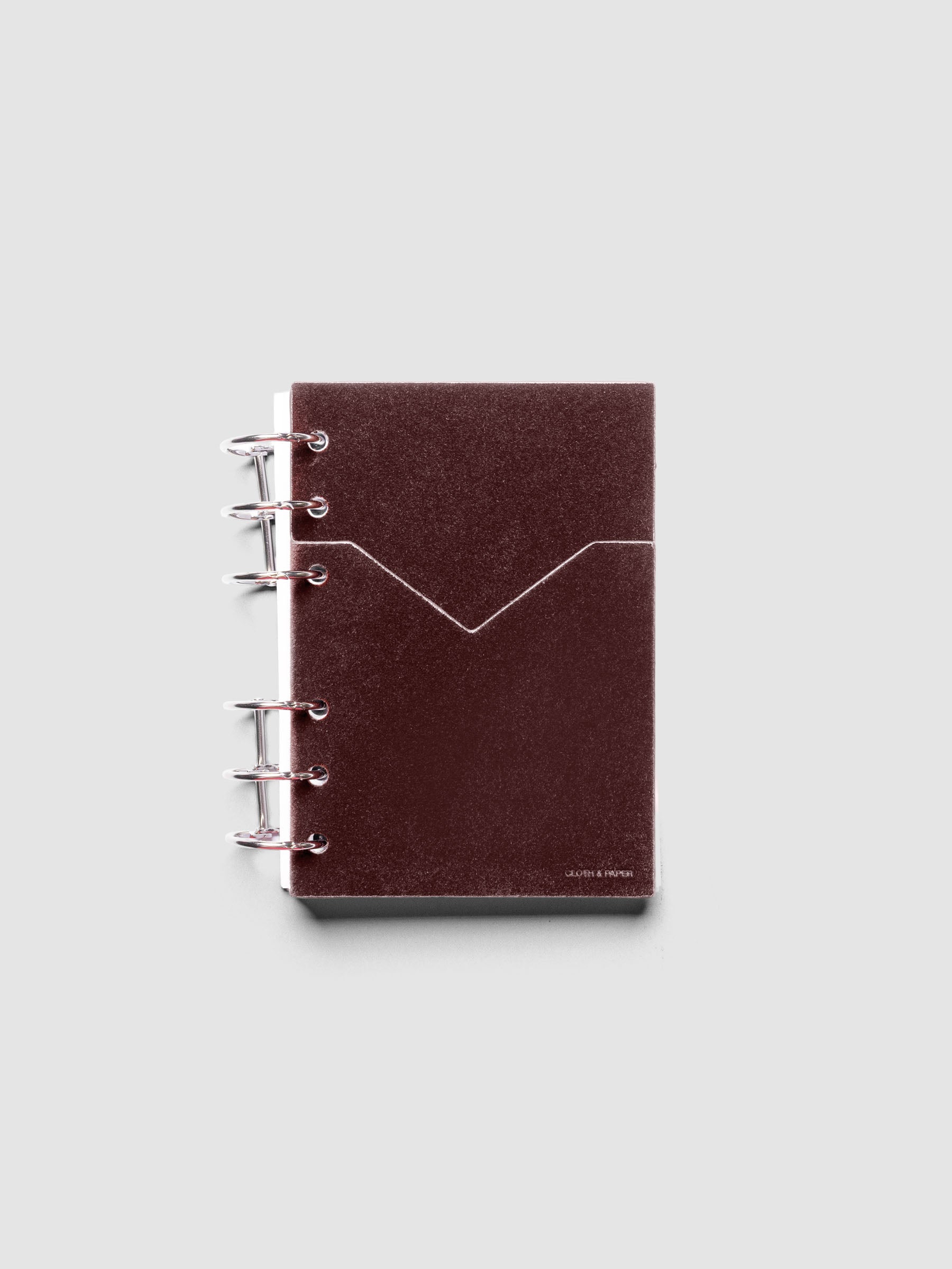 Velvet Pocket Folder in Bordeaux pre-punched for A6 planners shown ringbound.