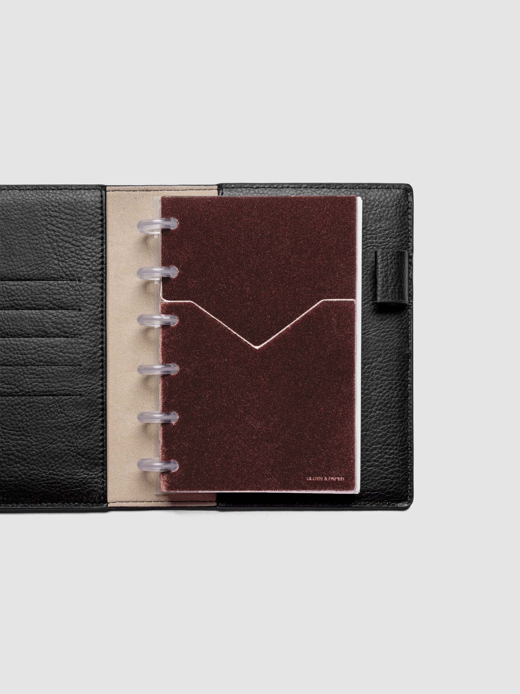 Velvet Pocket Folder in Bordeaux pre-punched for CP Petite planners shown in a black leather folio.