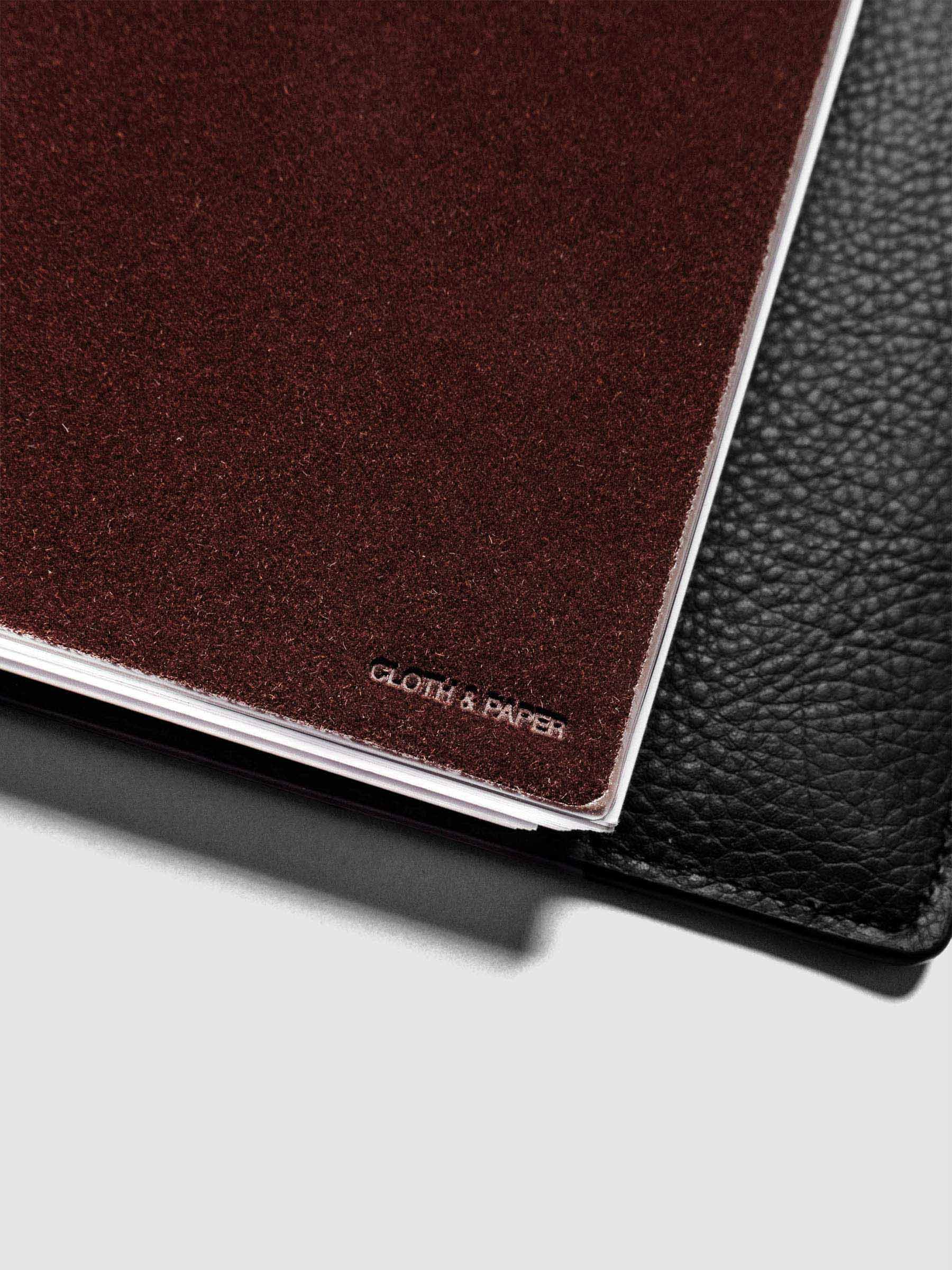 Close up image of the Velvet Pocket Folder in Bordeaux showing the Cloth & Paper logo.