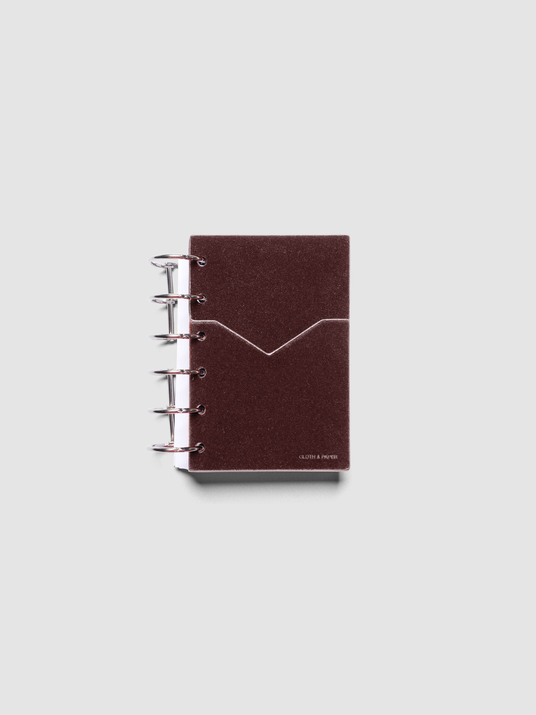 Velvet Pocket Folder in Bordeaux pre-punched for Pocket planners shown ringbound.