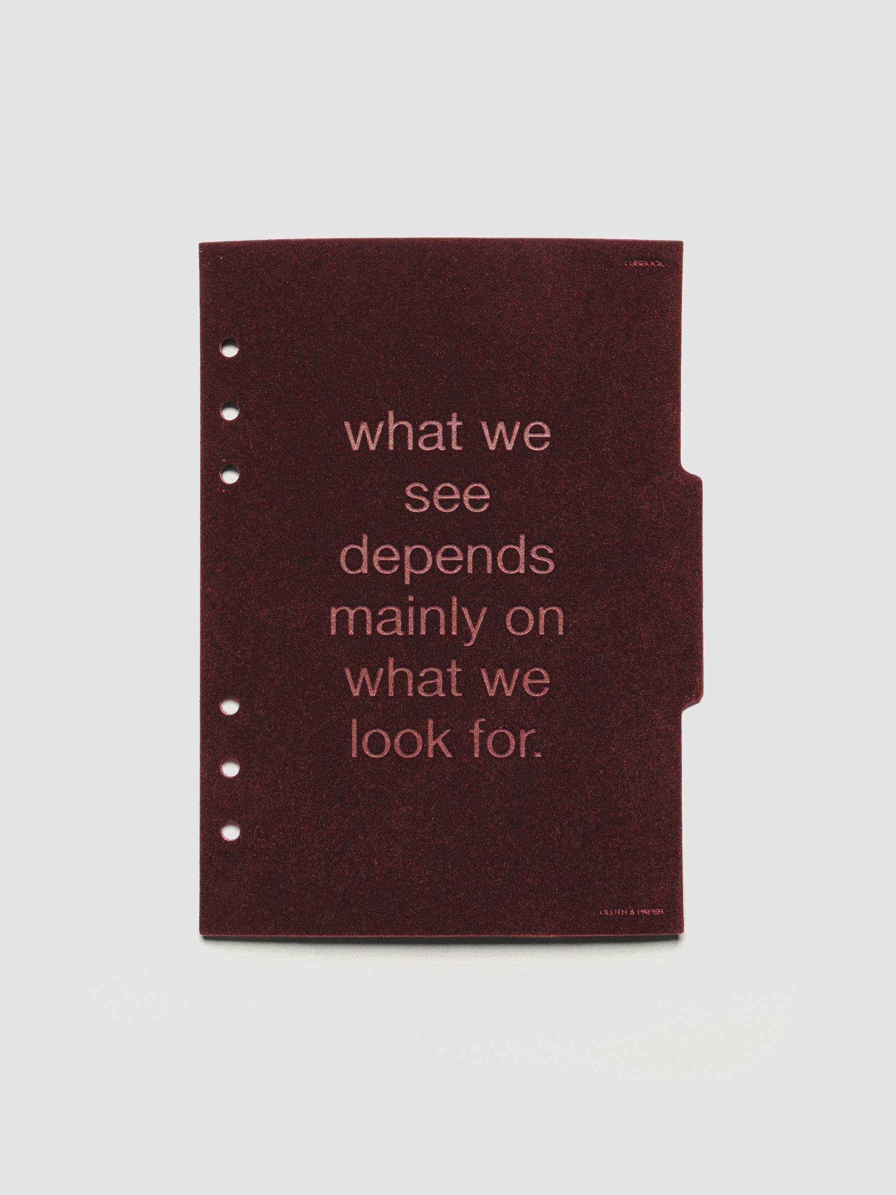 Second velvet side tab planners dividers in the color Bordeaux with text deboss design reading "what we see depends mainly on what we look for" in size A5.