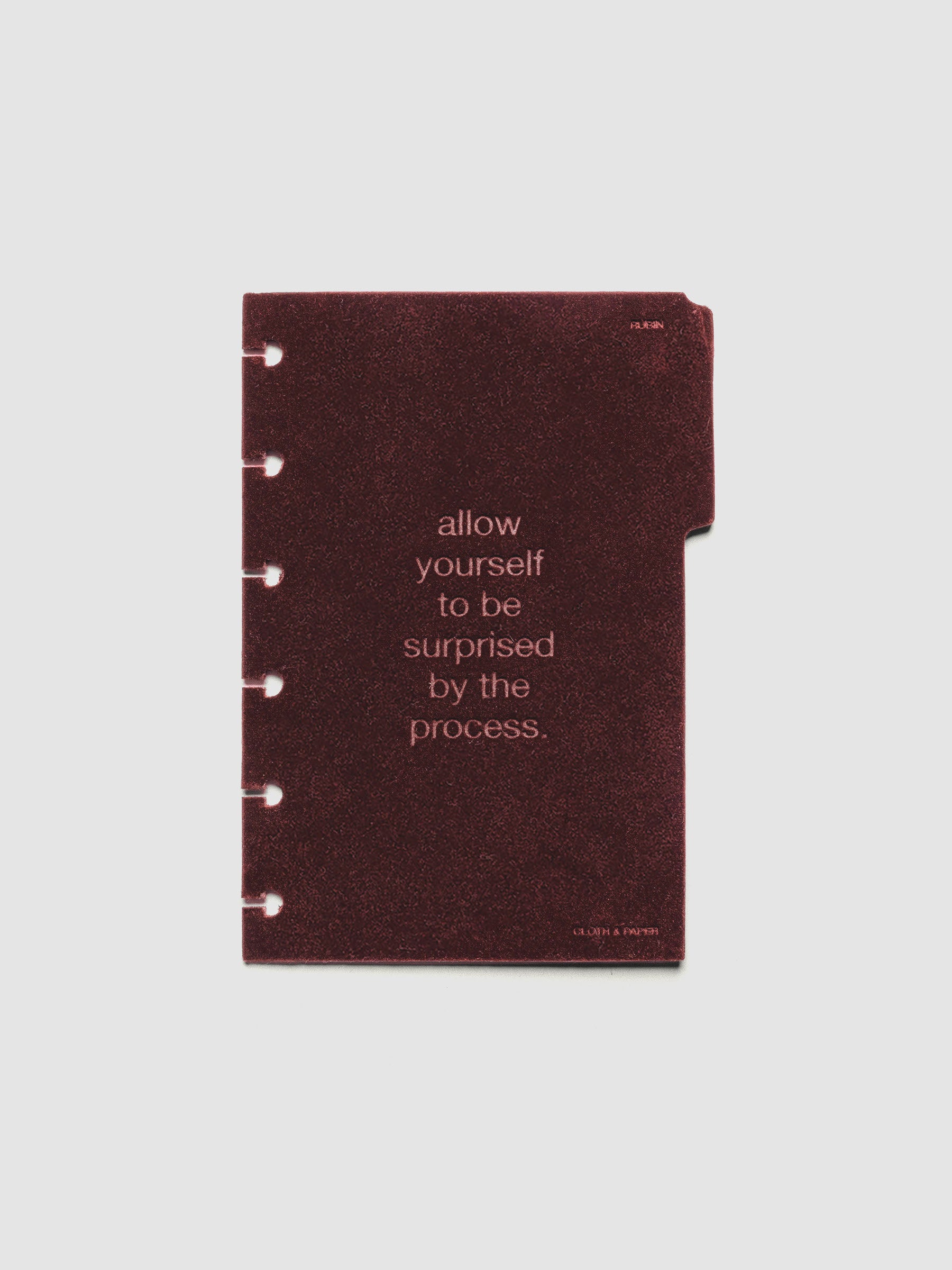First velvet side tab planners dividers in the color Bordeaux with text deboss design reading "allow yourself to be surprised by the process" in size CP Petite.