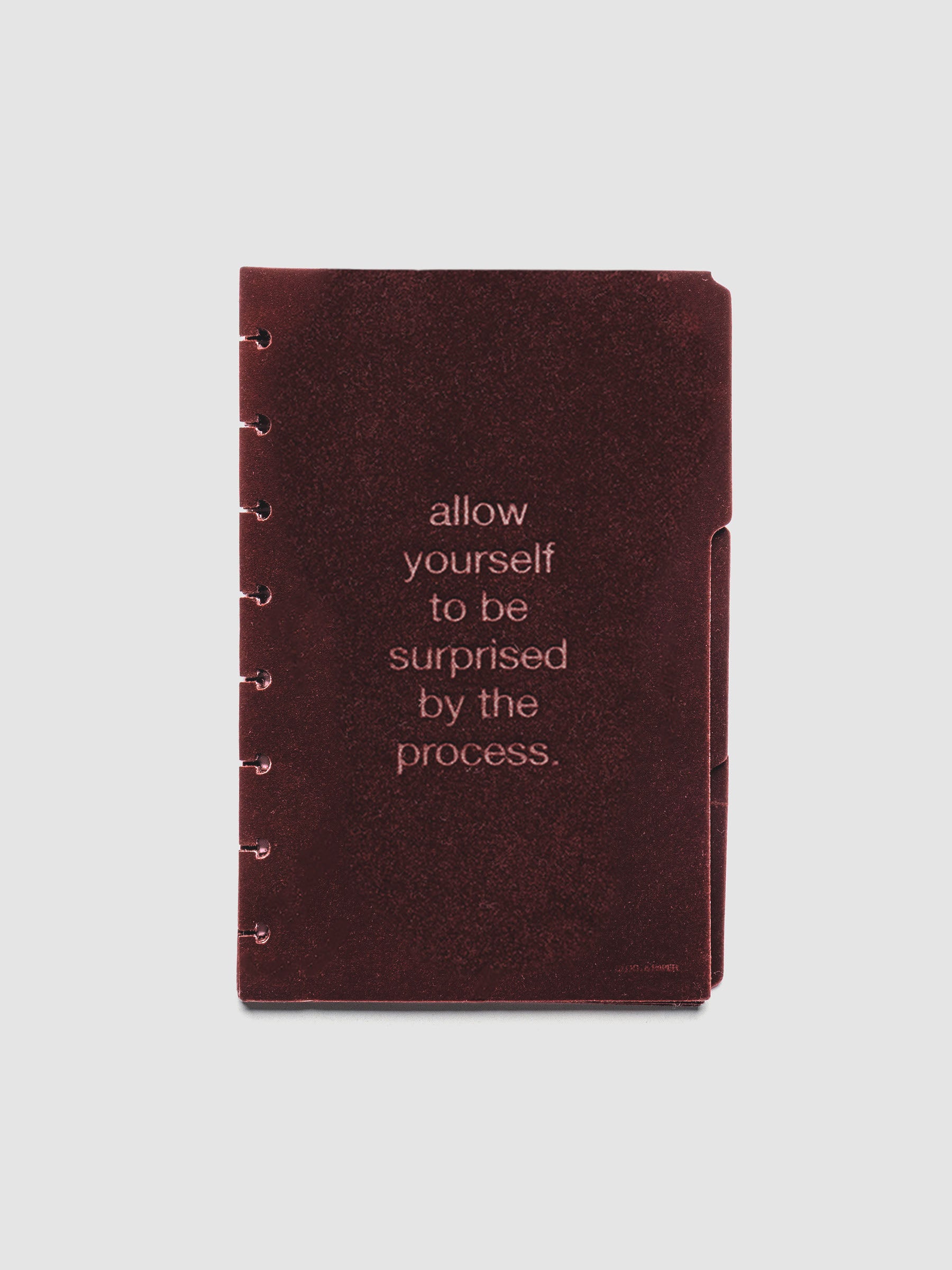 Three velvet side tab planners dividers in the color Bordeaux with text deboss designs shown in size Half Letter.
