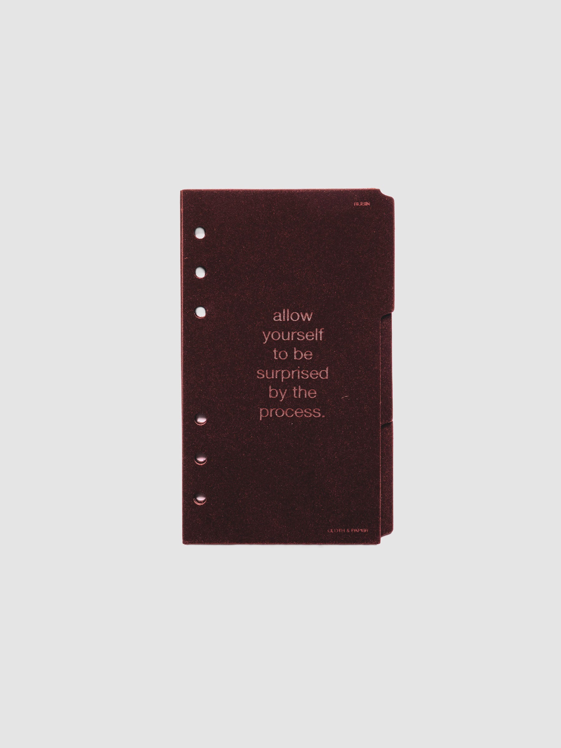 Three velvet side tab planners dividers in the color Bordeaux with text deboss designs shown in size Personal.