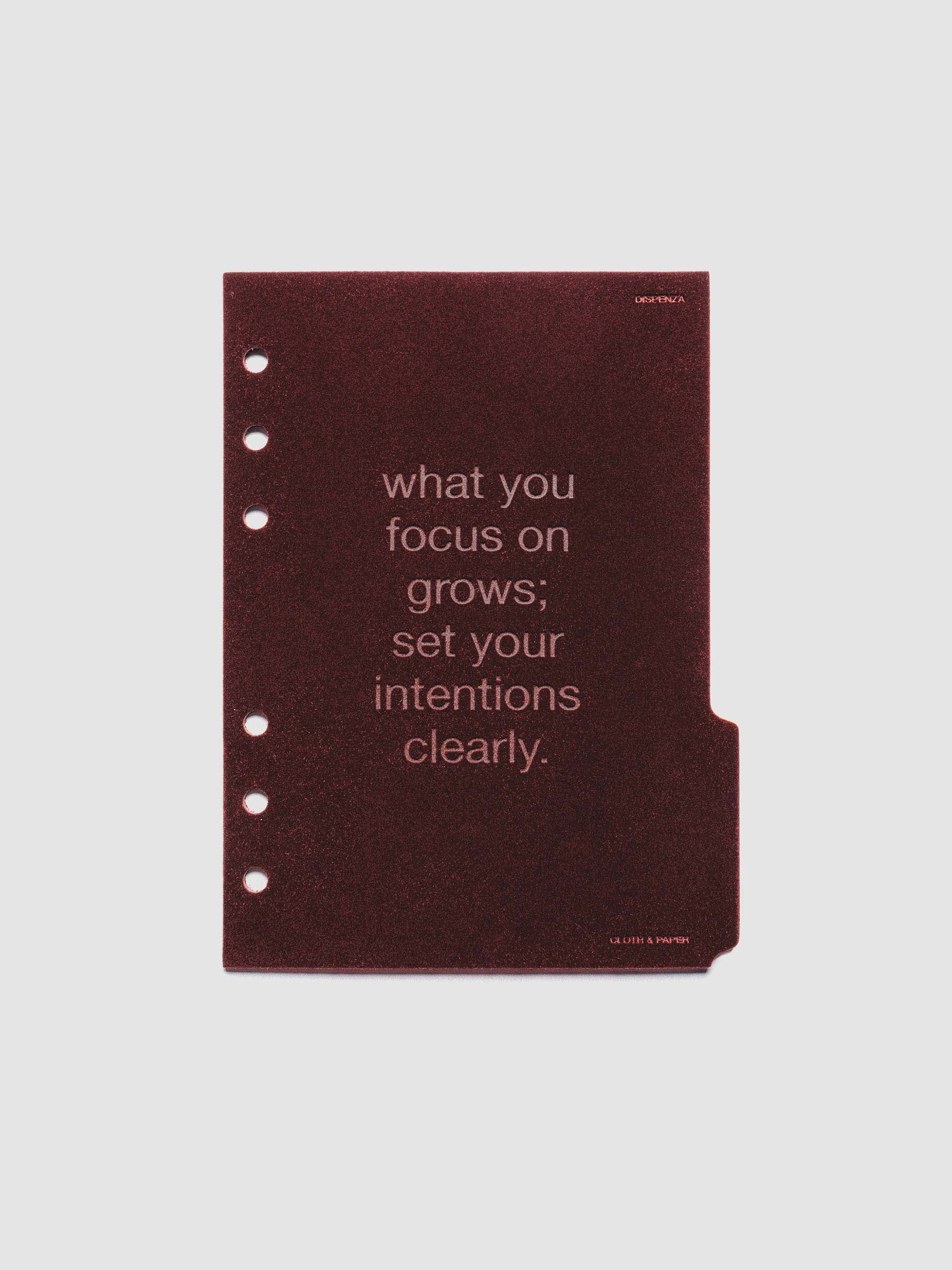 Third velvet side tab planners dividers in the color Bordeaux with text deboss design reading "what you focus on grows; set your intentions clearly" in size Personal Wide.