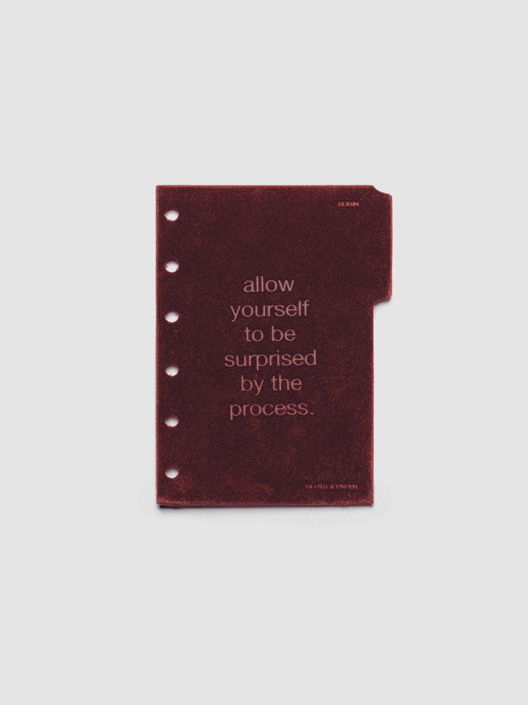 First velvet side tab planners dividers in the color Bordeaux with text deboss design reading "allow yourself to be surprised by the process" in size Pocket.