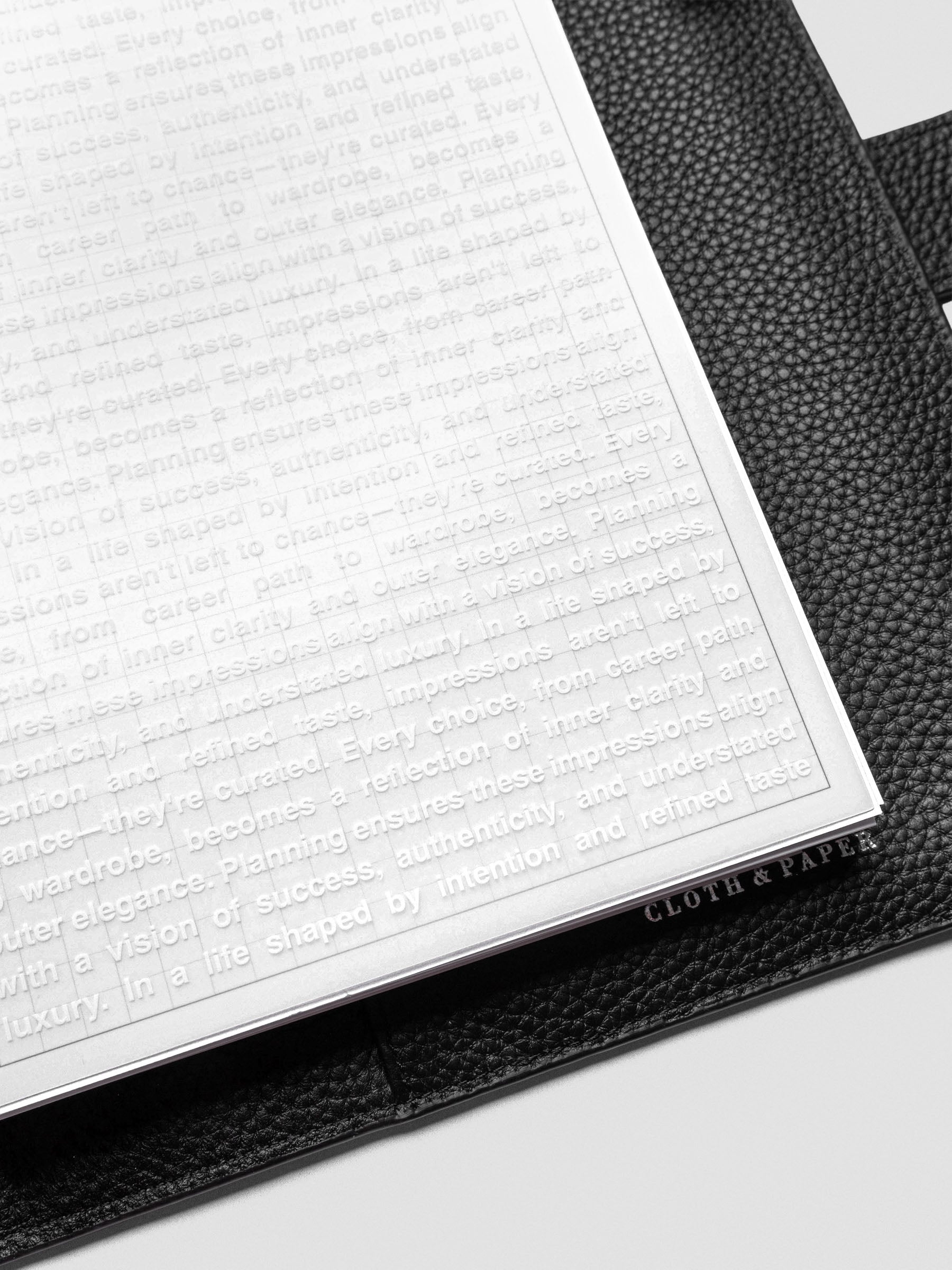 A5 Impressions Dashboard angled view highlighting printed text on translucent vellum.