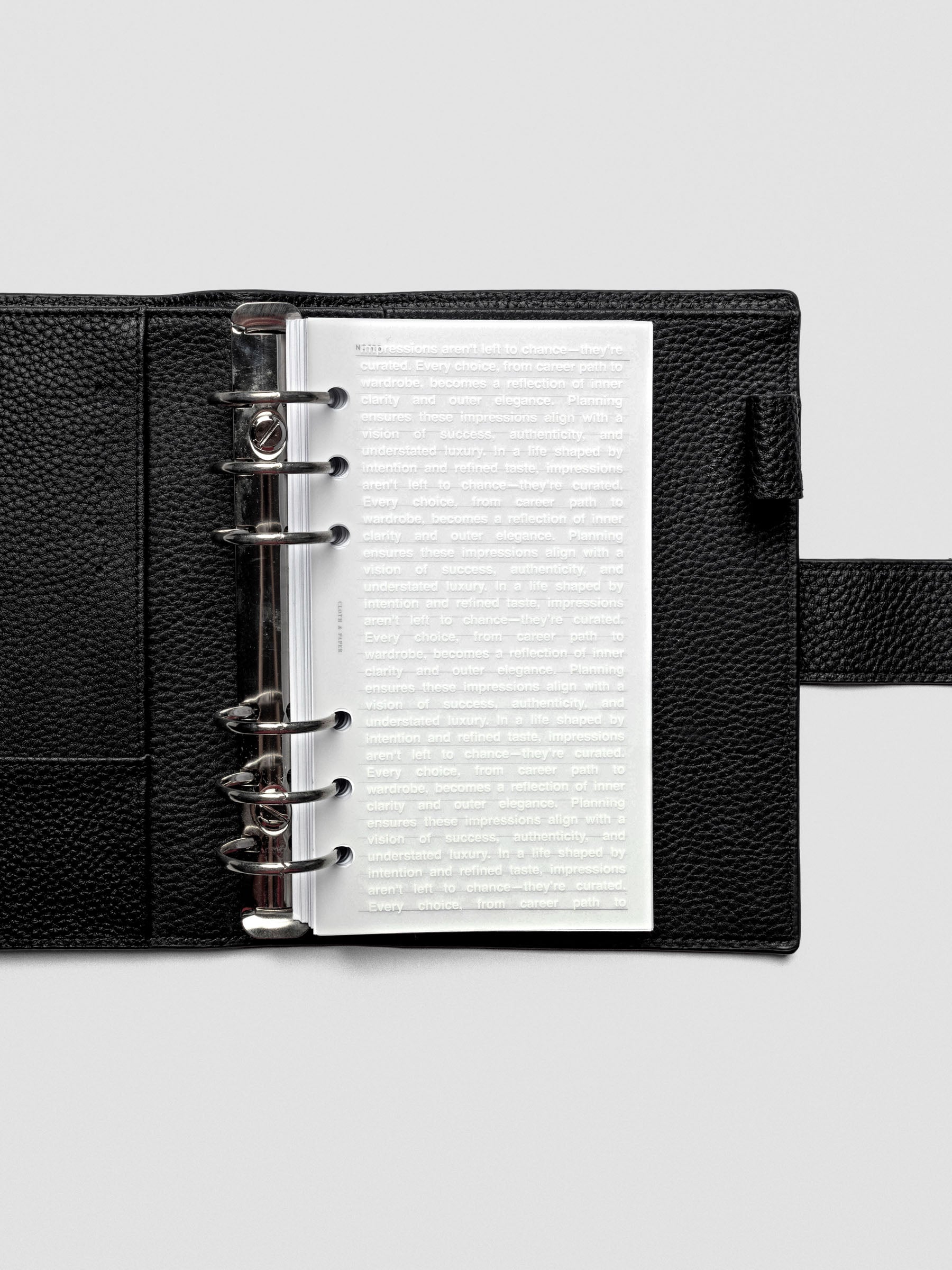 Personal-size Impressions Dashboard displayed inside a ring-bound planner.