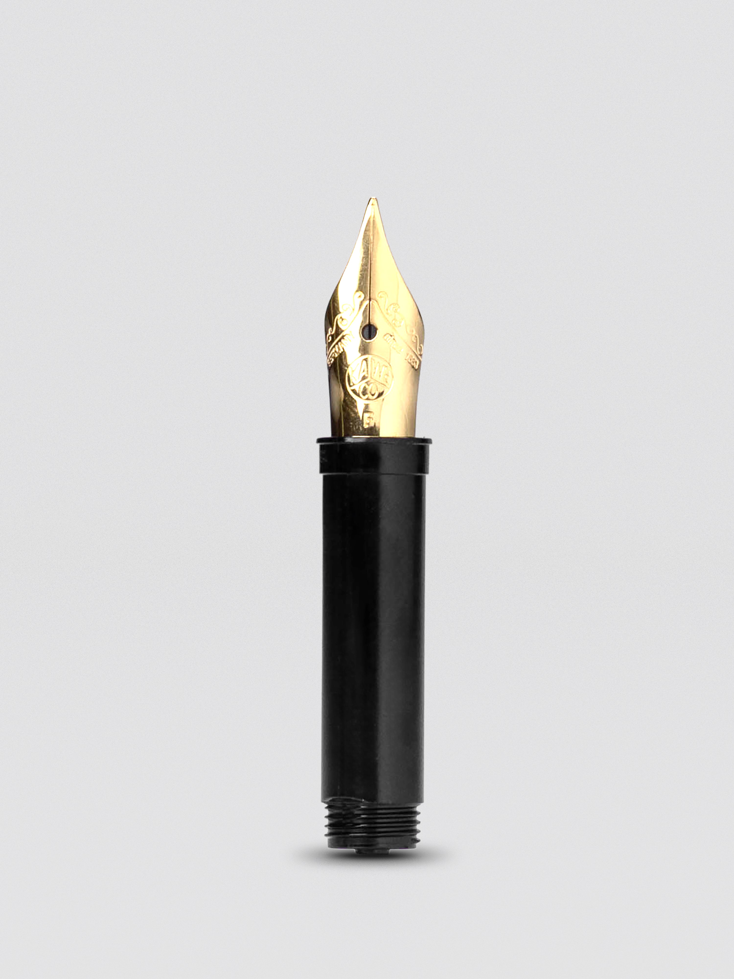 Kaweco replacement fountain pen nib, fine, gold color, close product view on white background.