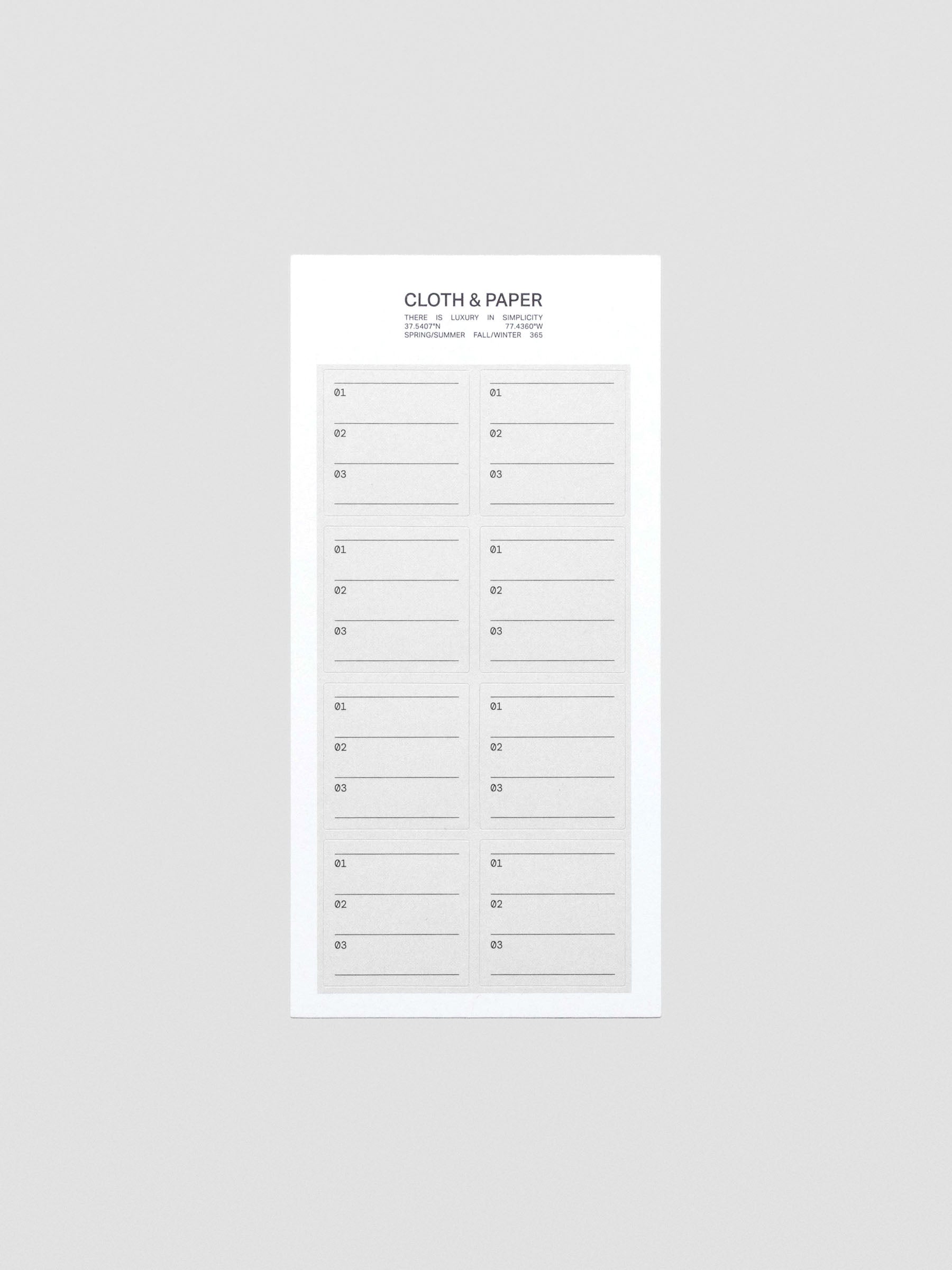 Flat lay of black and grey Priority label sticker.
