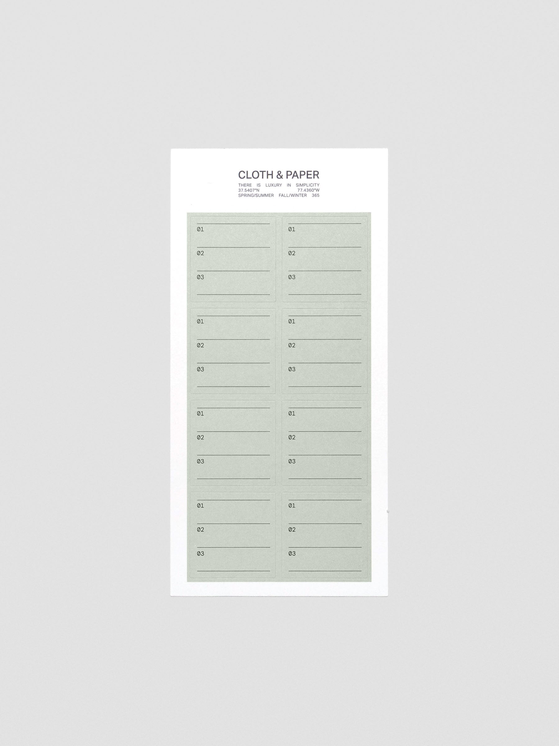 Flat lay of Priority label sticker sheets in black and matcha green.