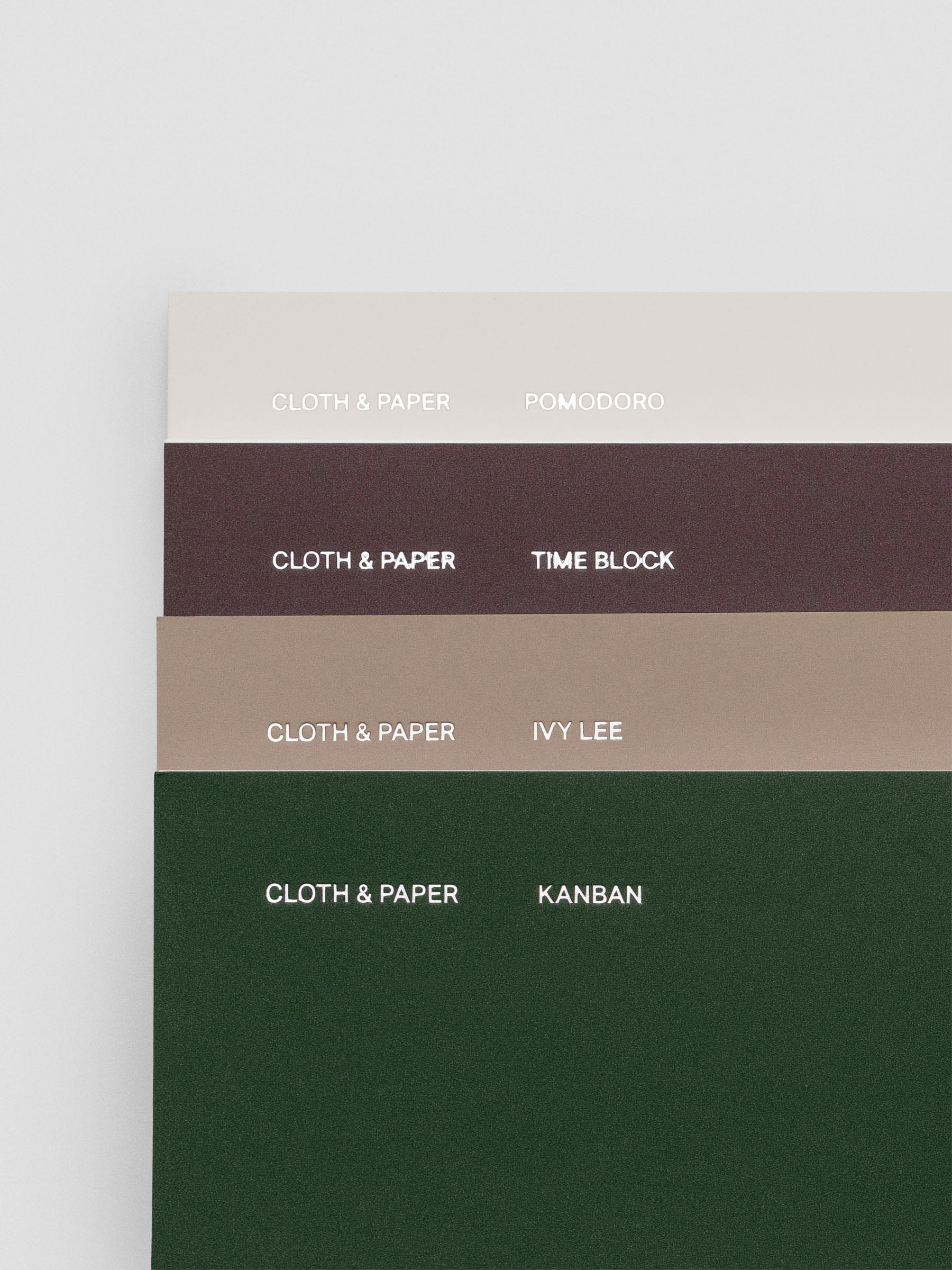 Planning notebooks in A5 Slim size shown fanned out with covers visible.