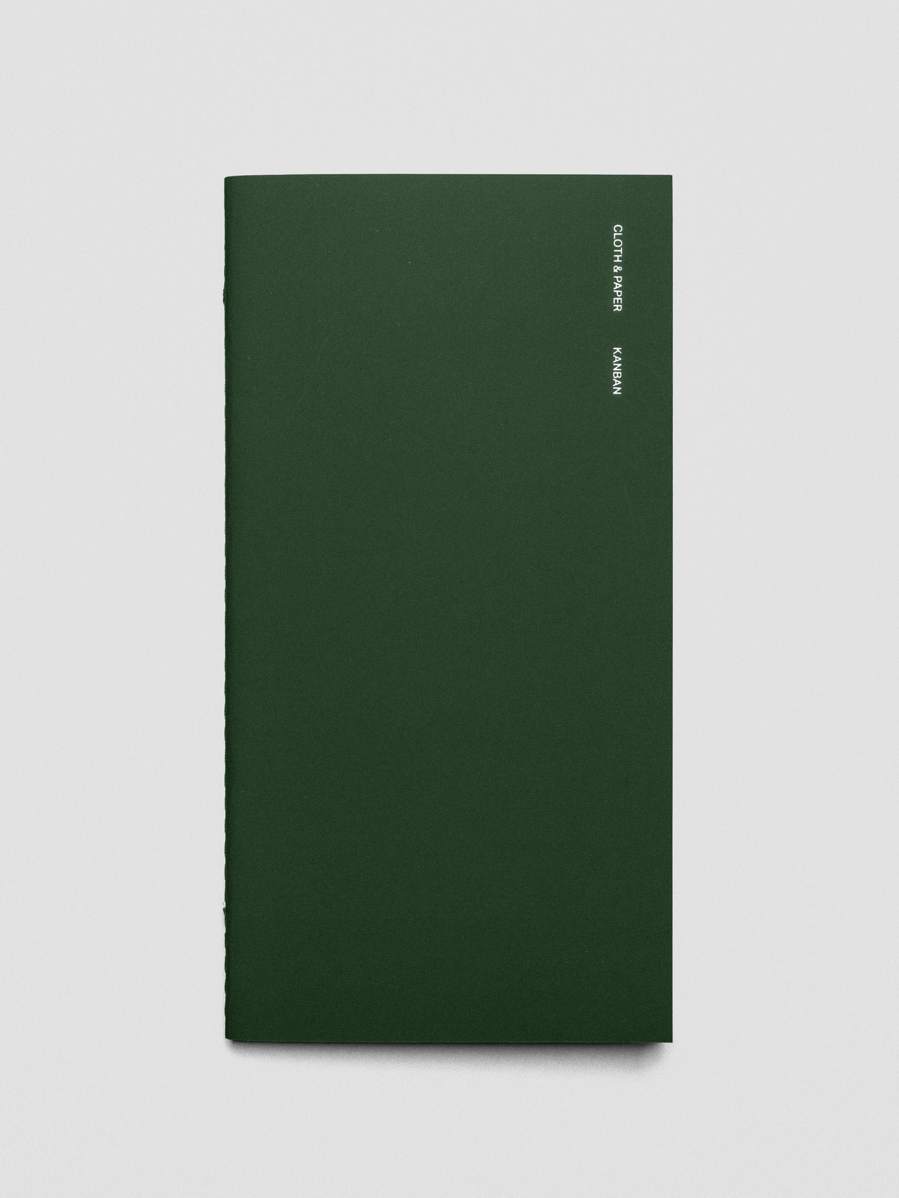 Cover of the Kanban A5 Slim notebook placed flat on a desk.