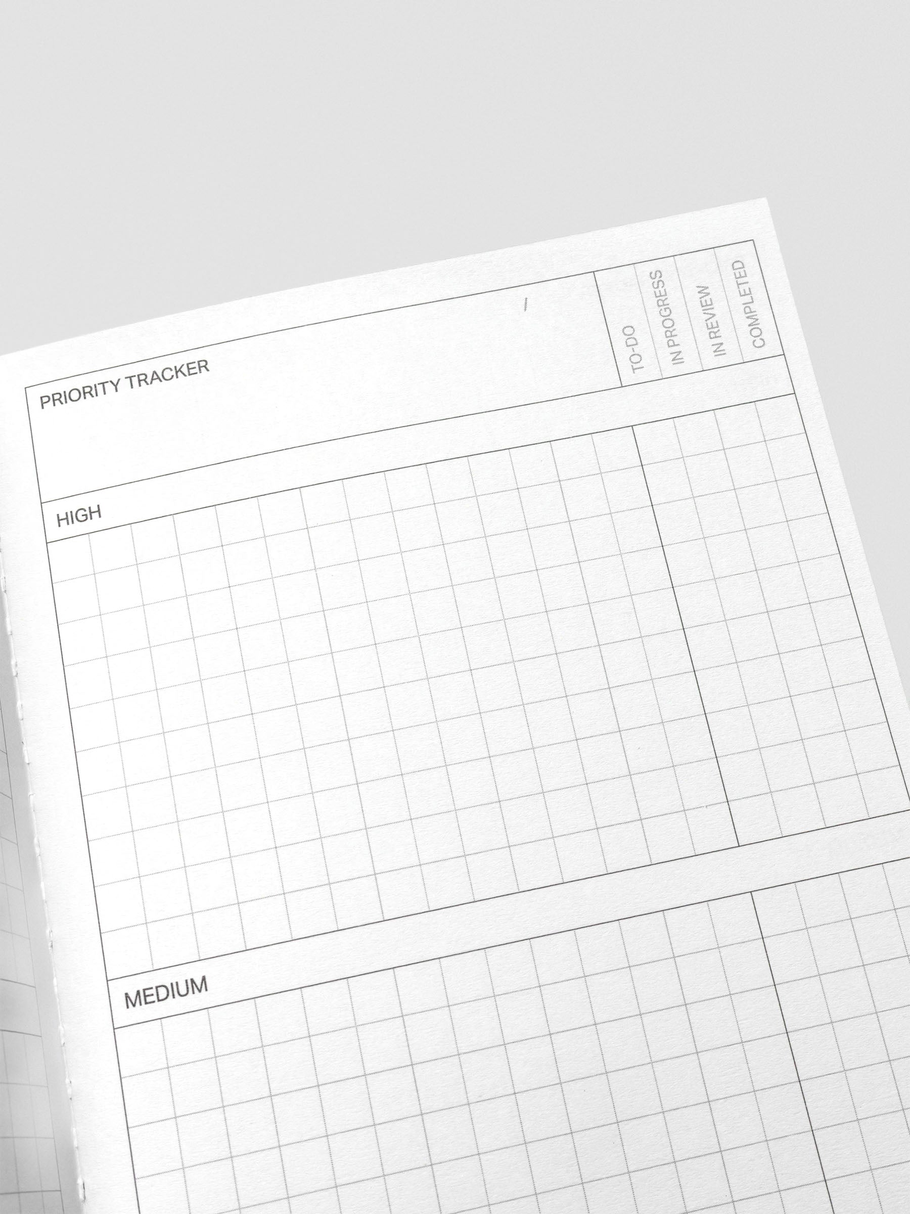 Close-up of Kanban Method notebook pages with categorized columns.