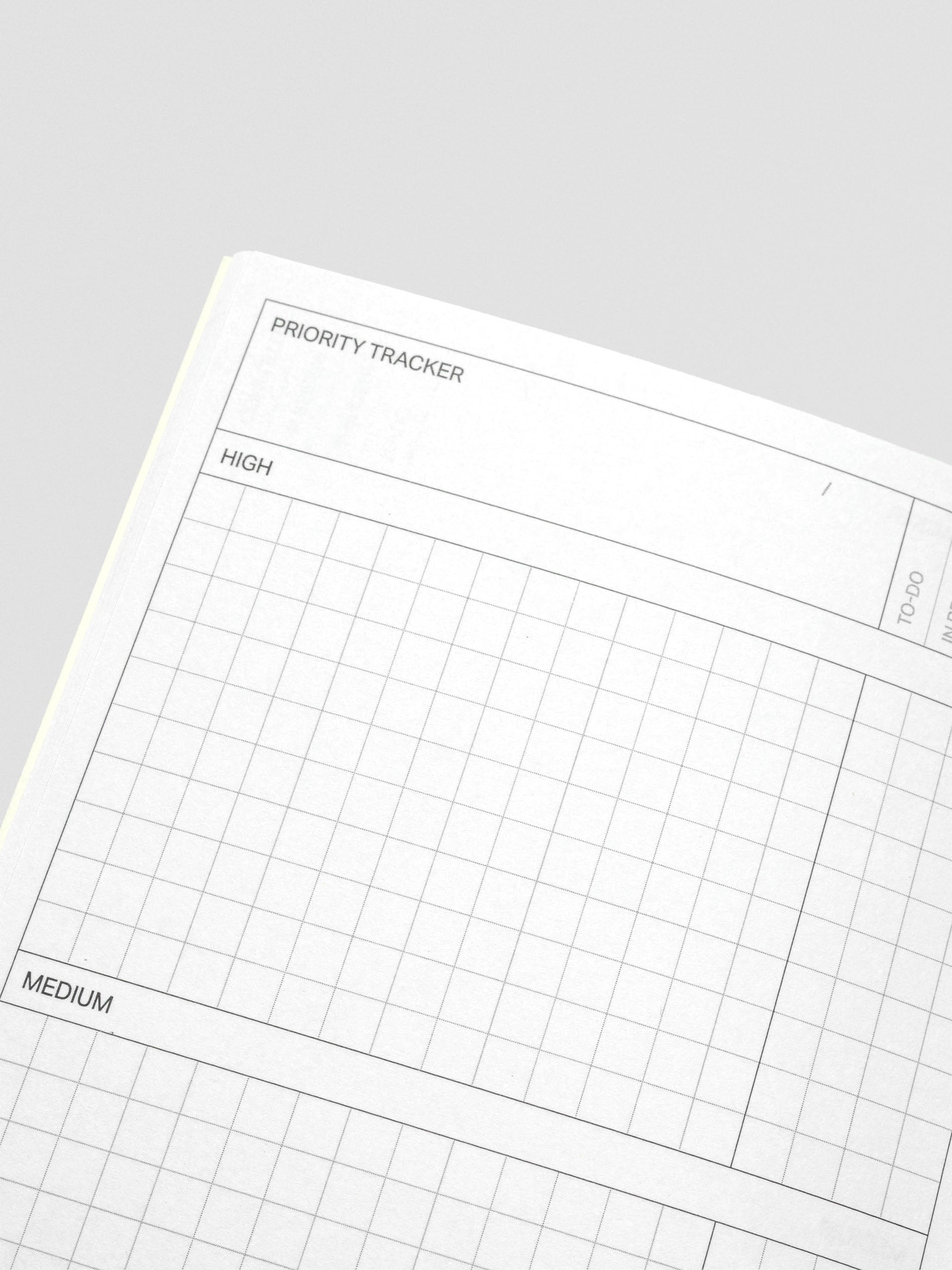 Kanban notebooks fanned out with covers visible.
