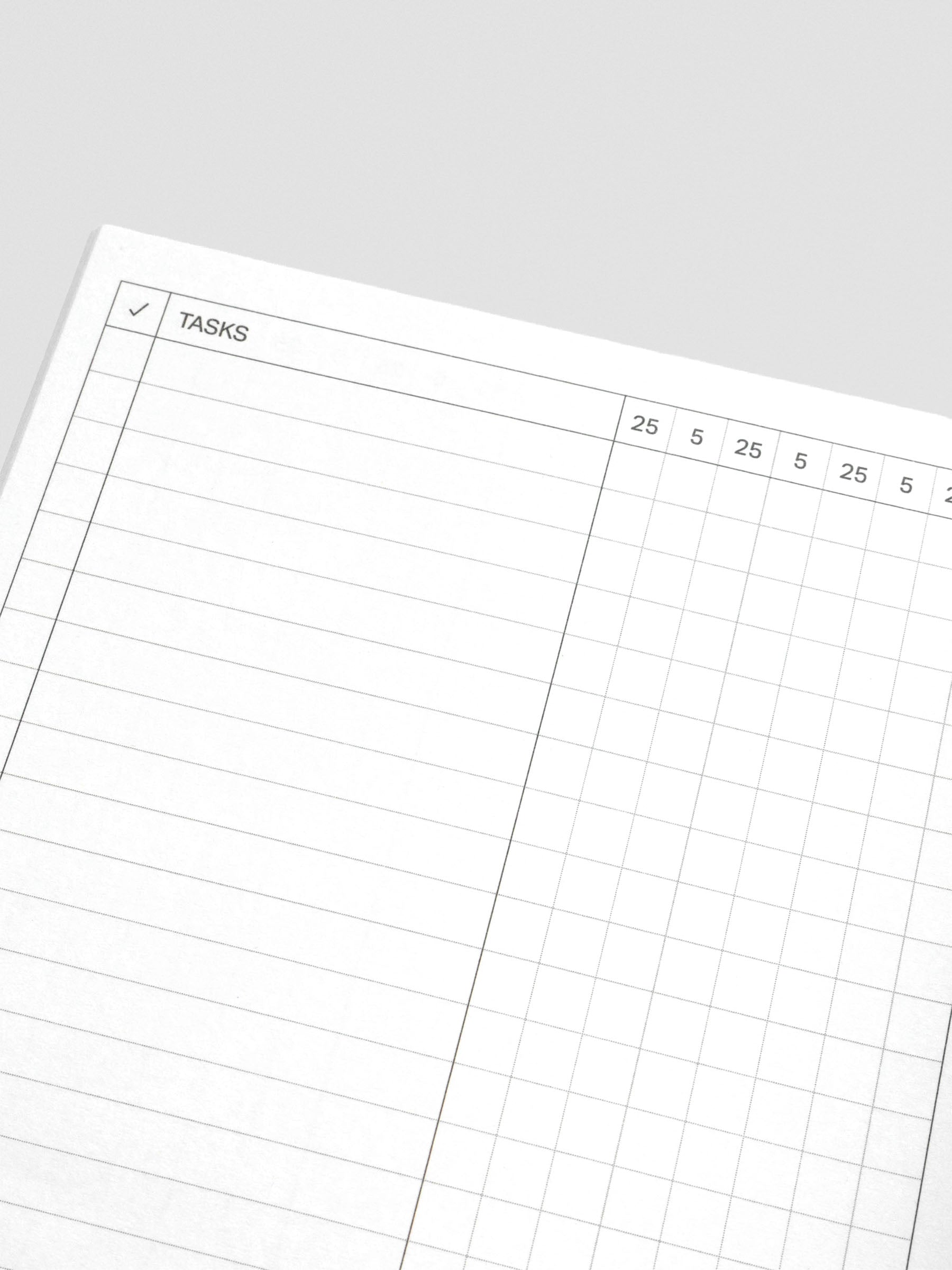 Pomodoro notebooks arranged in a neat stack.