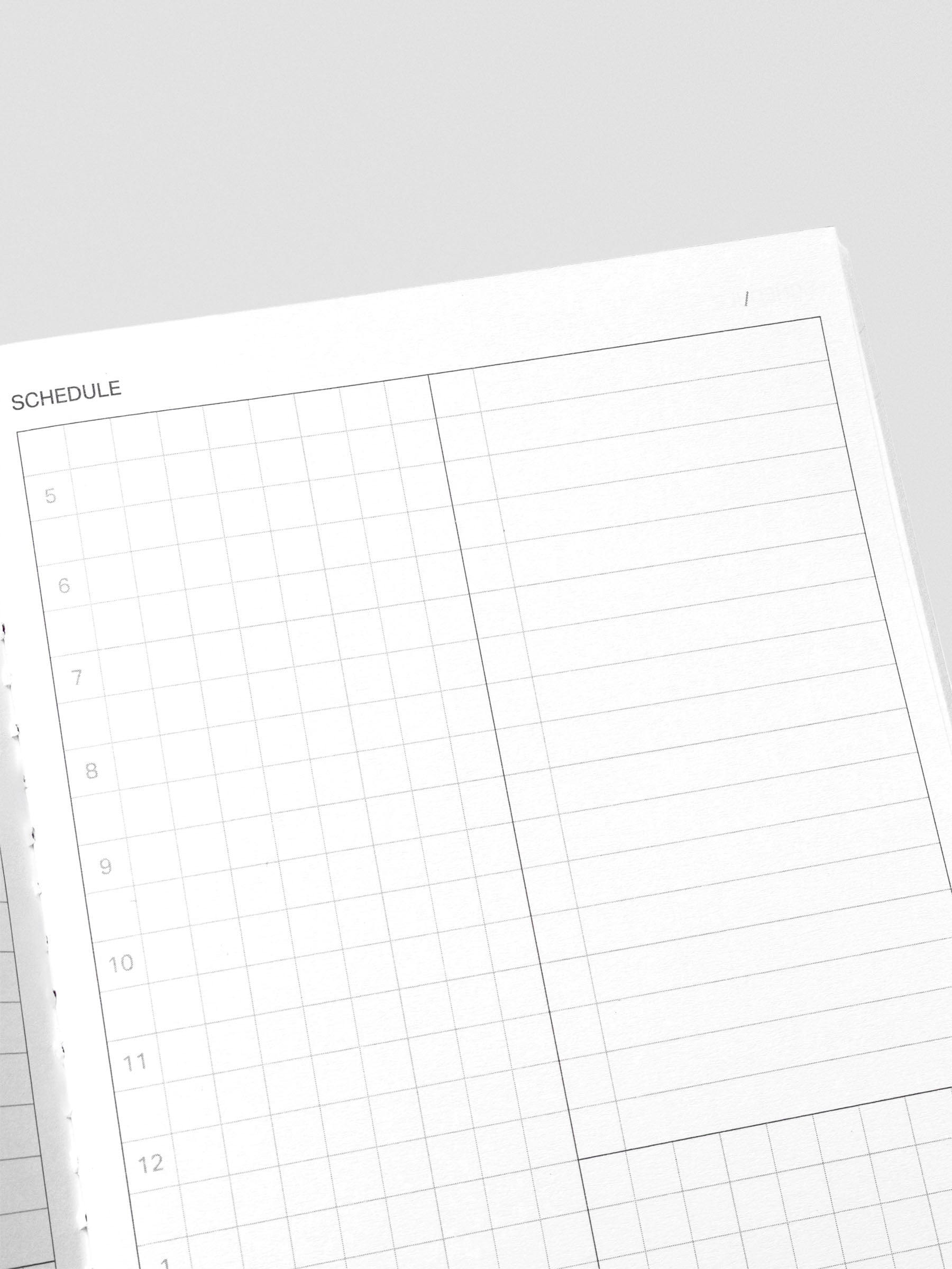 Close-up of Time Blocking Method notebook pages with time slots.