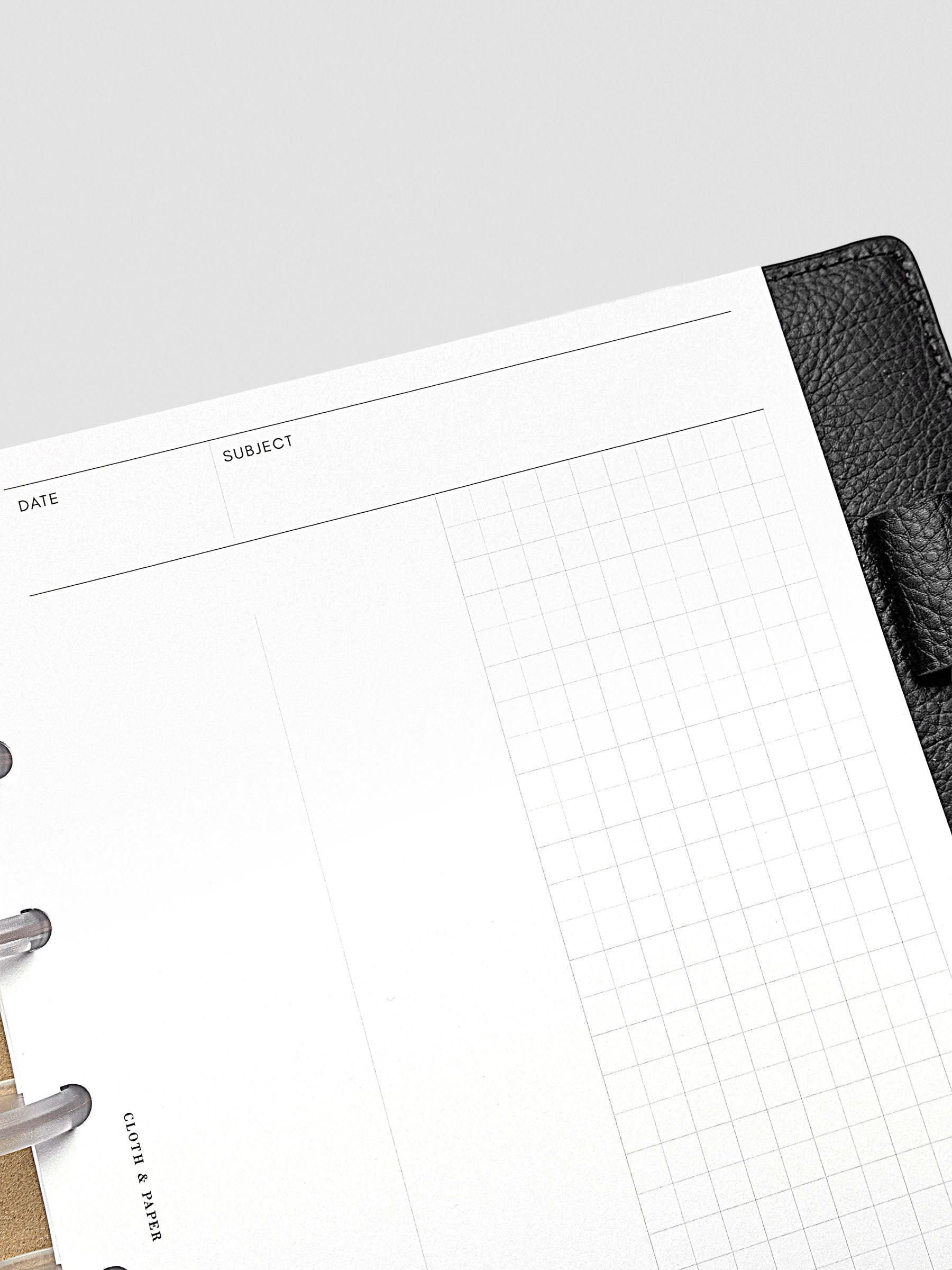 Half Letter planner insert open to show clean grid pages with flexible use.