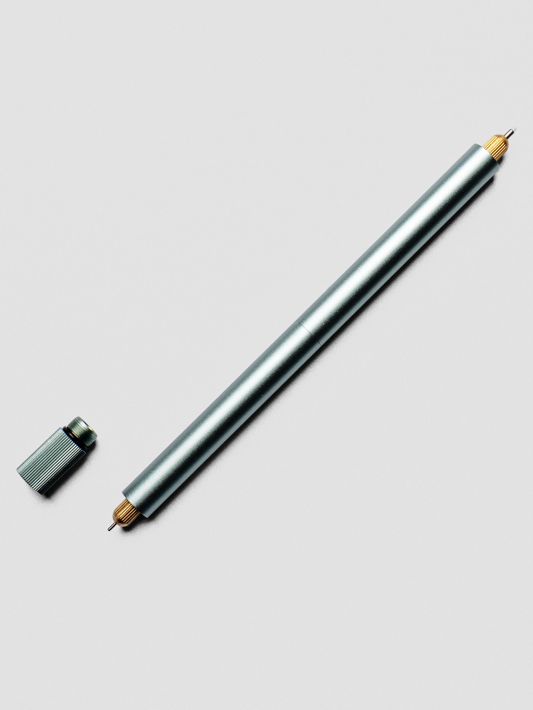 Close-up of uncapped Sage Green Lumos Pro Duo Tip Pen with writing tip visible.