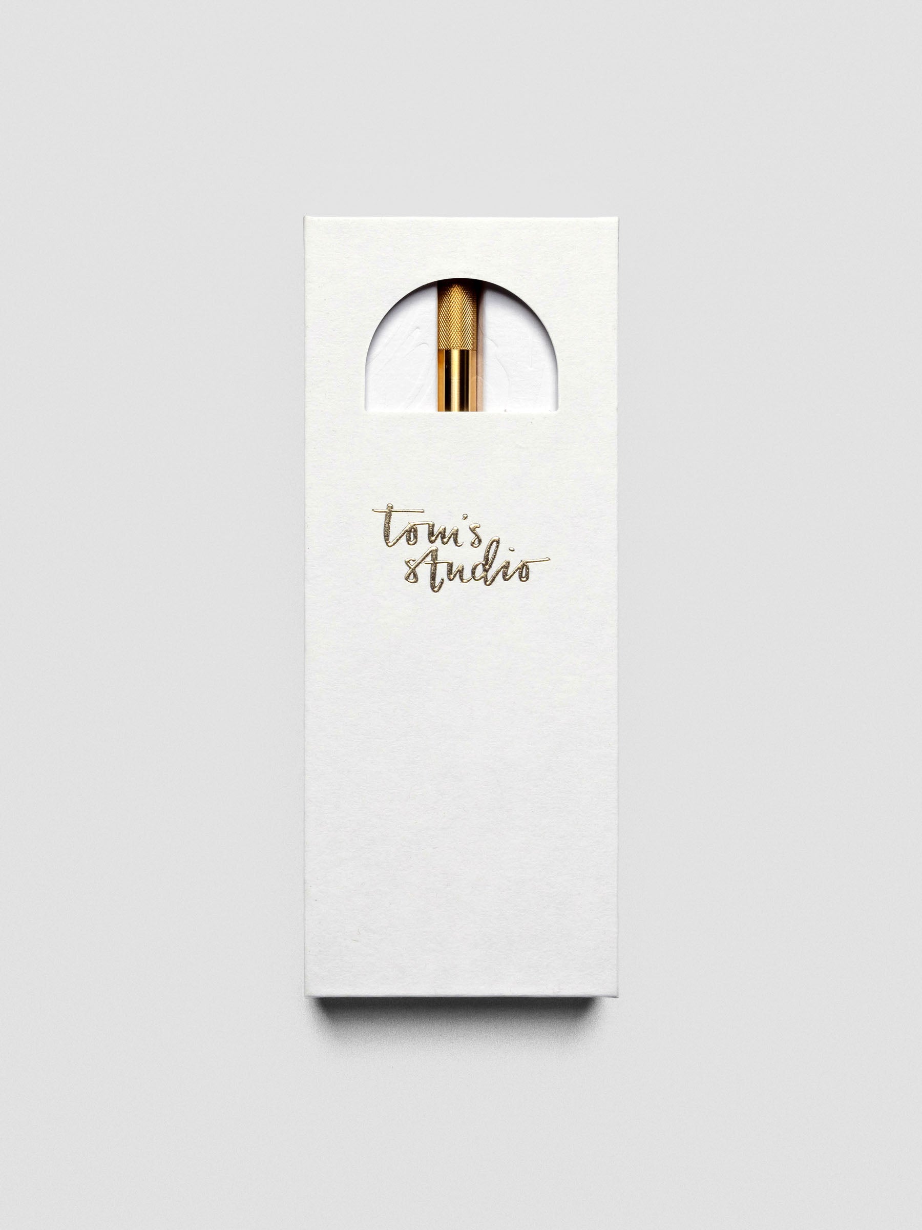 Lumos Pro Single Tip Pen in Brass, shown in packaging.