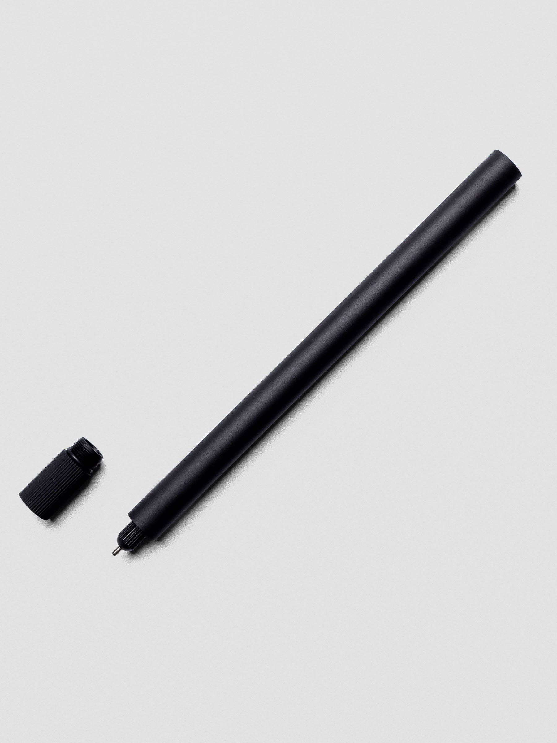 Lumos Pro Single Tip Pen in Matte Black uncapped with nib exposed.