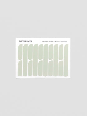 Sheet of Confidential Collection torn strip stickers in matcha green on white background.