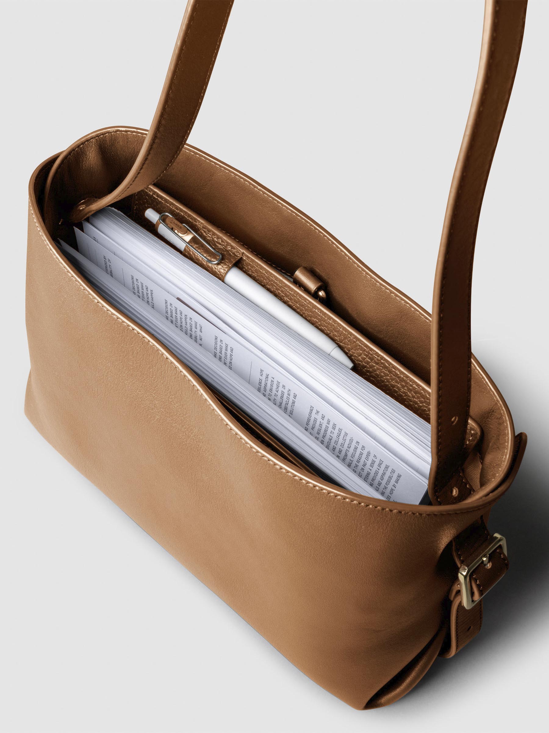 Bag shown from above with a planner inside of it. Color shown is Alhambra.