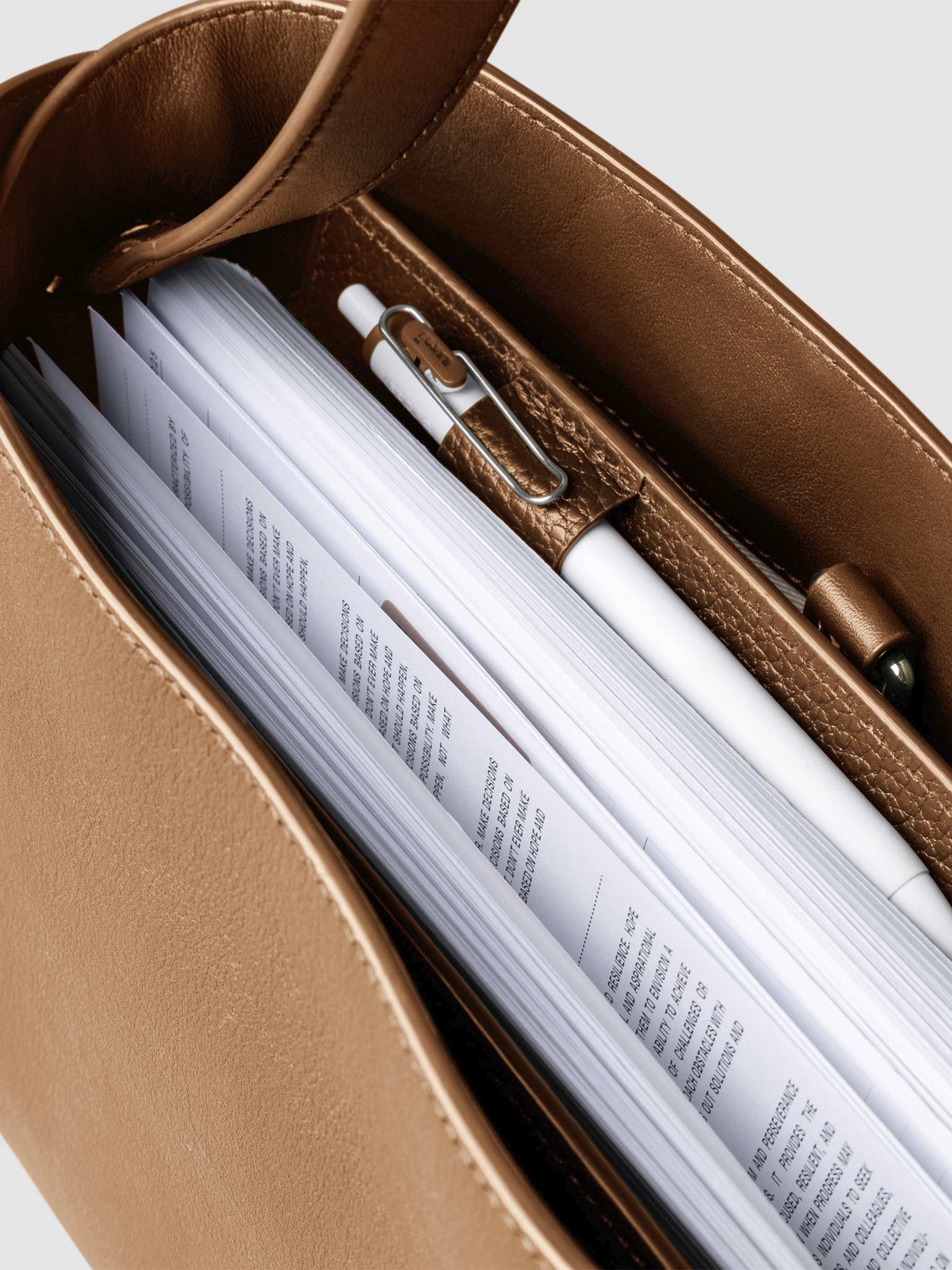 Bag shown from above with a planner inside of it. Color shown is Alhambra.