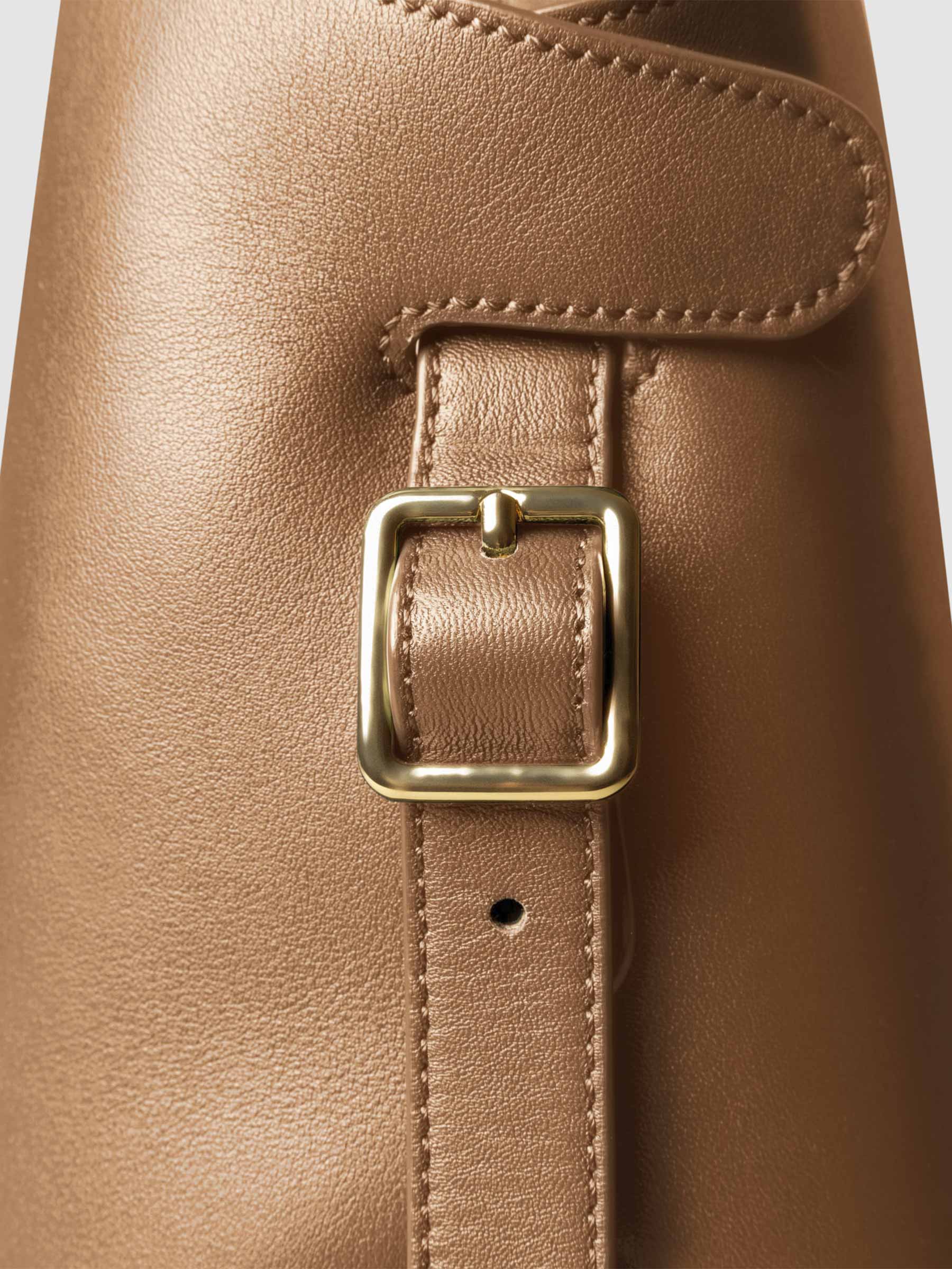 Side view of bag showcasing its gold hardware and adjustable leather strap. Color shown is Alhambra.