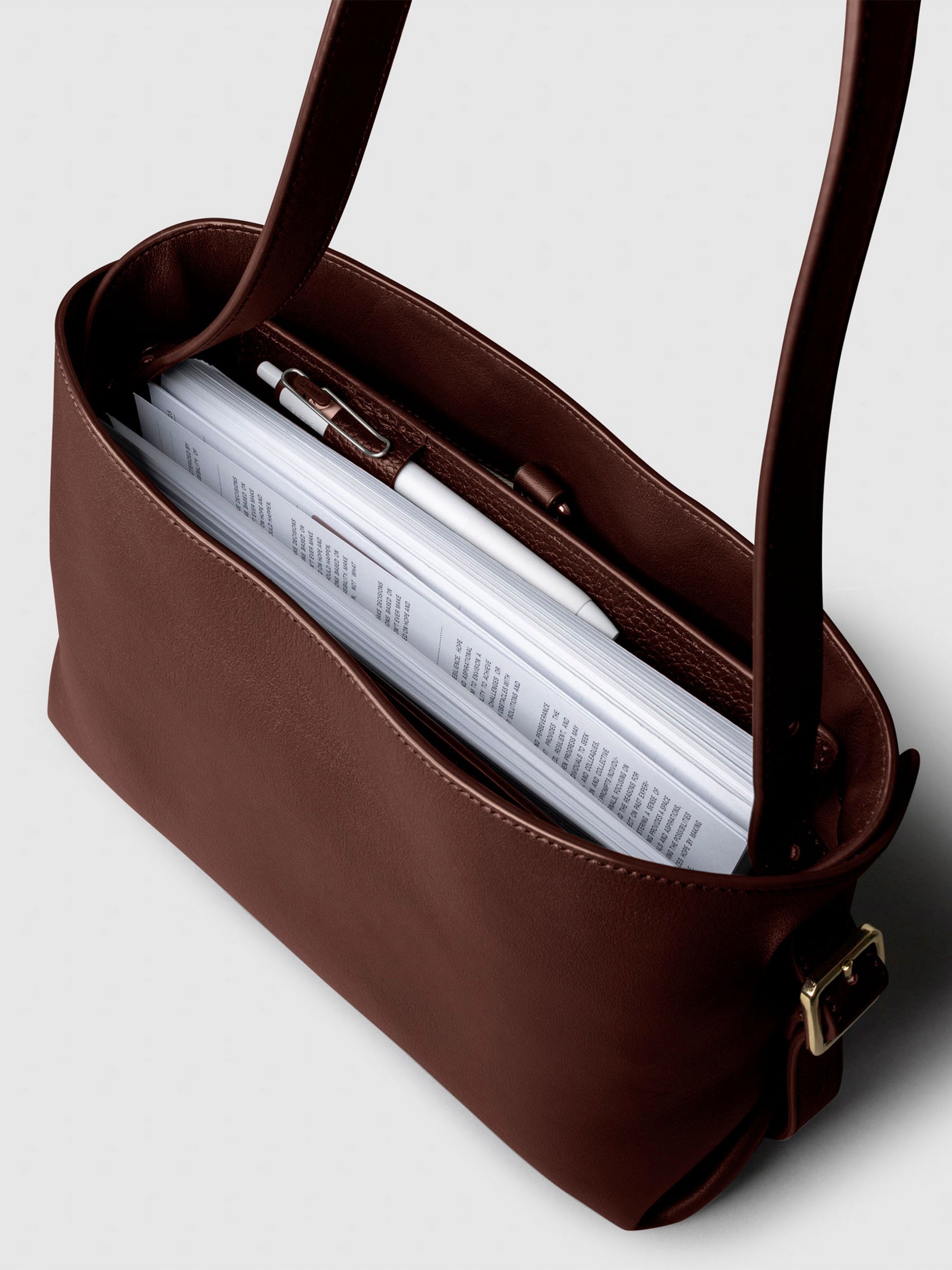 Bag shown from above with a planner inside of it. Color shown is Cordoba.