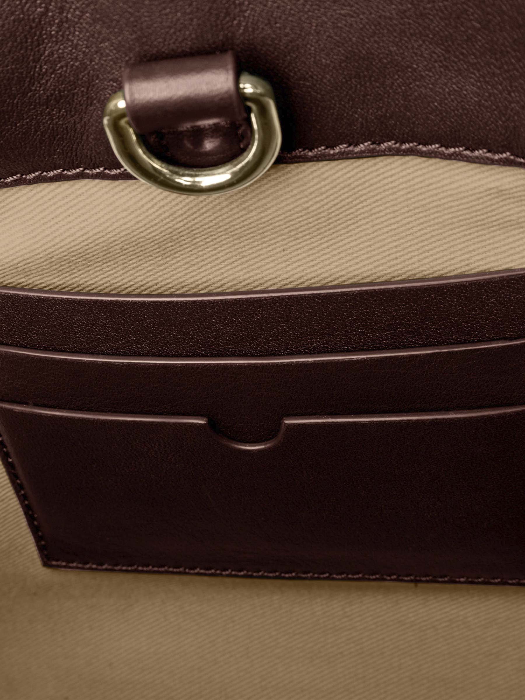 Closeup of credit card slots inside bag. Color shown is Cordoba.