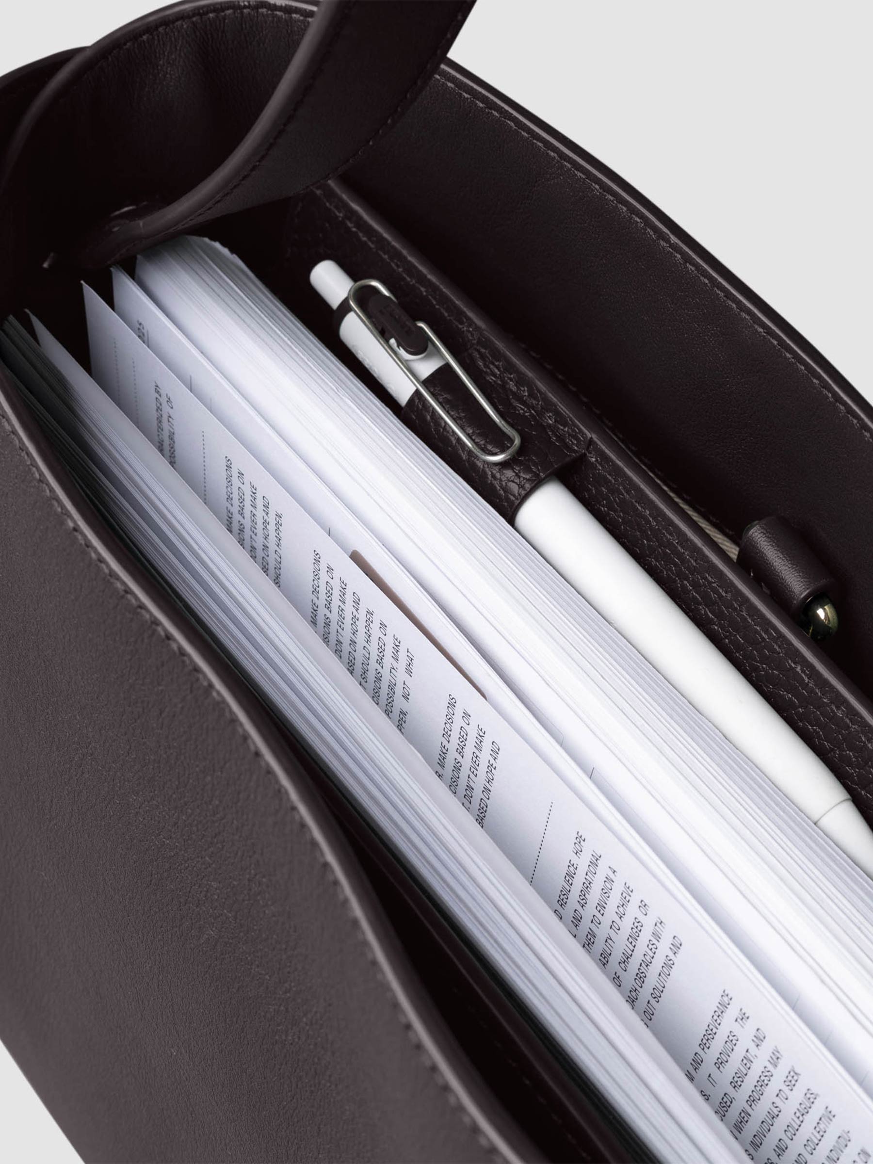 Bag shown from above with a planner inside of it. Color shown is Madrid.